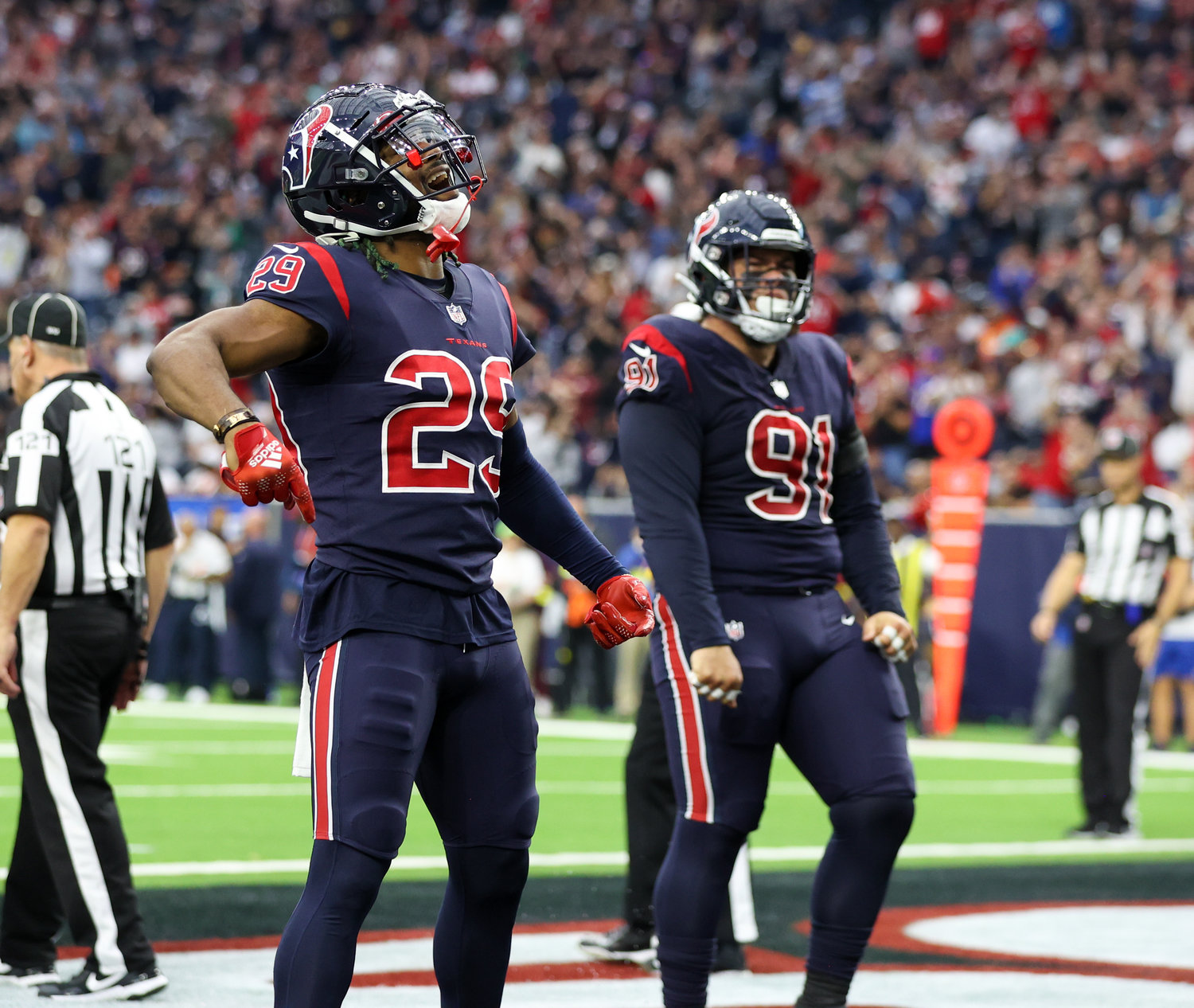 Houston Texans safety M.J. Stewart (29) and defensive tackle Roy Lopez (91) reacts after the Texans stopped Cleveland Browns running back Nick Chubb in the end zone for a safety during an NFL game between the Houston Texans and the Cleveland Browns on Dec. 4, 2022, in Houston. The Browns won, 27-14.
