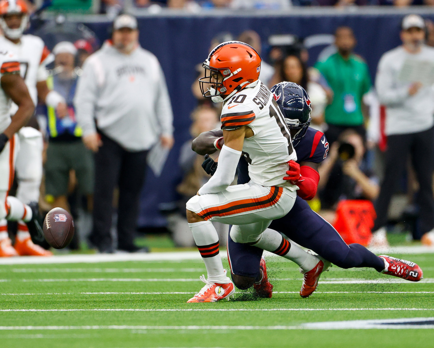 Cleveland Browns wide receiver Anthony Schwartz (10) fumbles the ball after being hit by Houston Texans cornerback Tavierre Thomas (2) during an NFL game between the Houston Texans and the Cleveland Browns on Dec. 4, 2022, in Houston. The Browns won, 27-14.