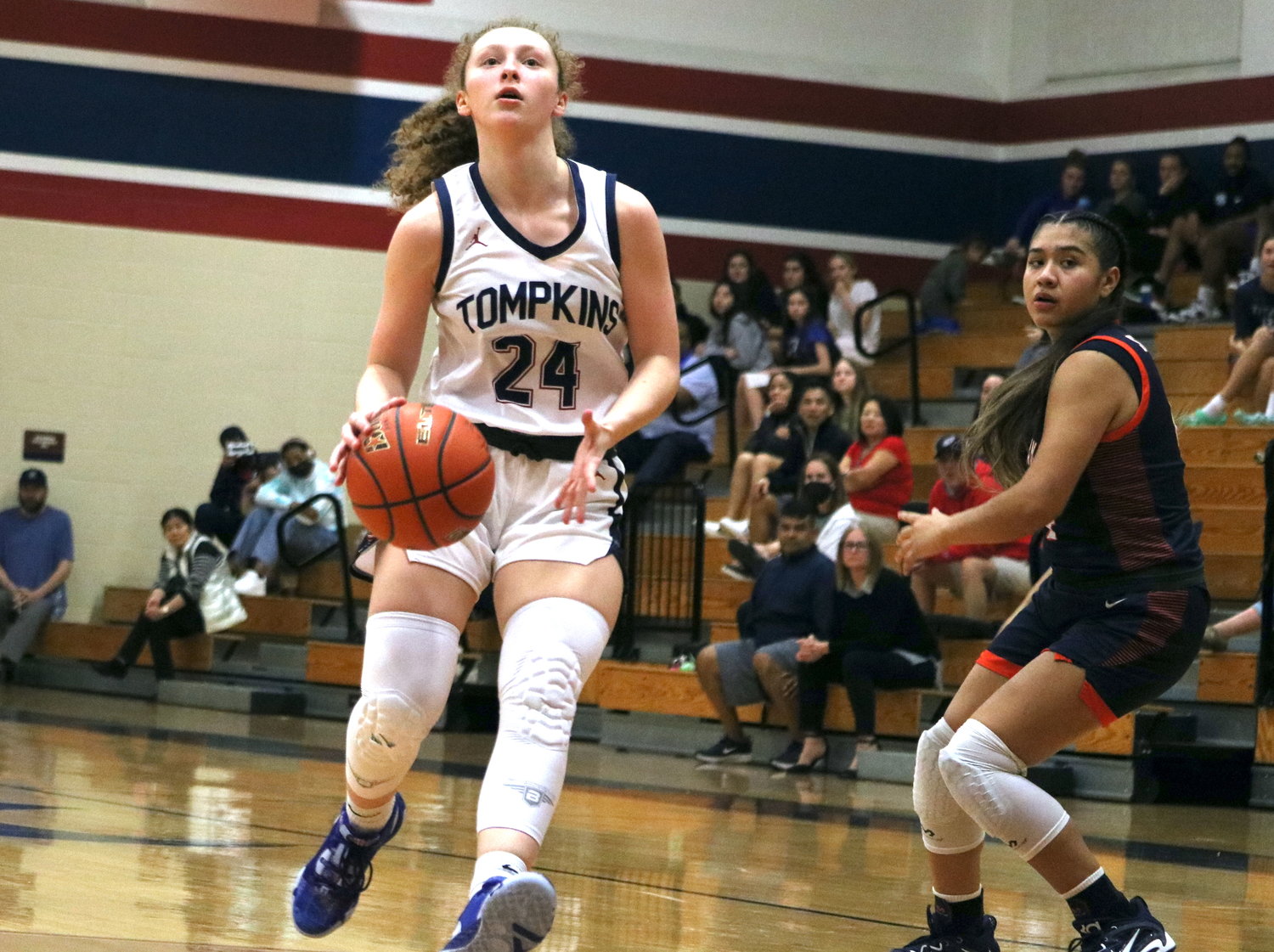Gabby Panter dribbles past a defender during Tuesday’s District 19-6A game between Tompkins and Seven Lakes at the Tompkins gym.