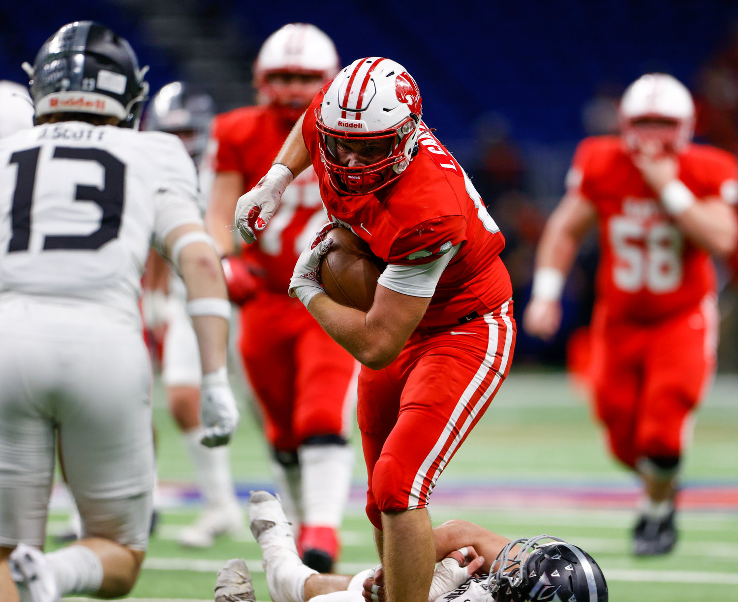 Katy tight end Luke Carter (84) carries the ball after a catch for a first down during the Class 6A-DII state semifinal football game between Katy and Vandegrift on Dec. 10, 2022 in San Antonio.