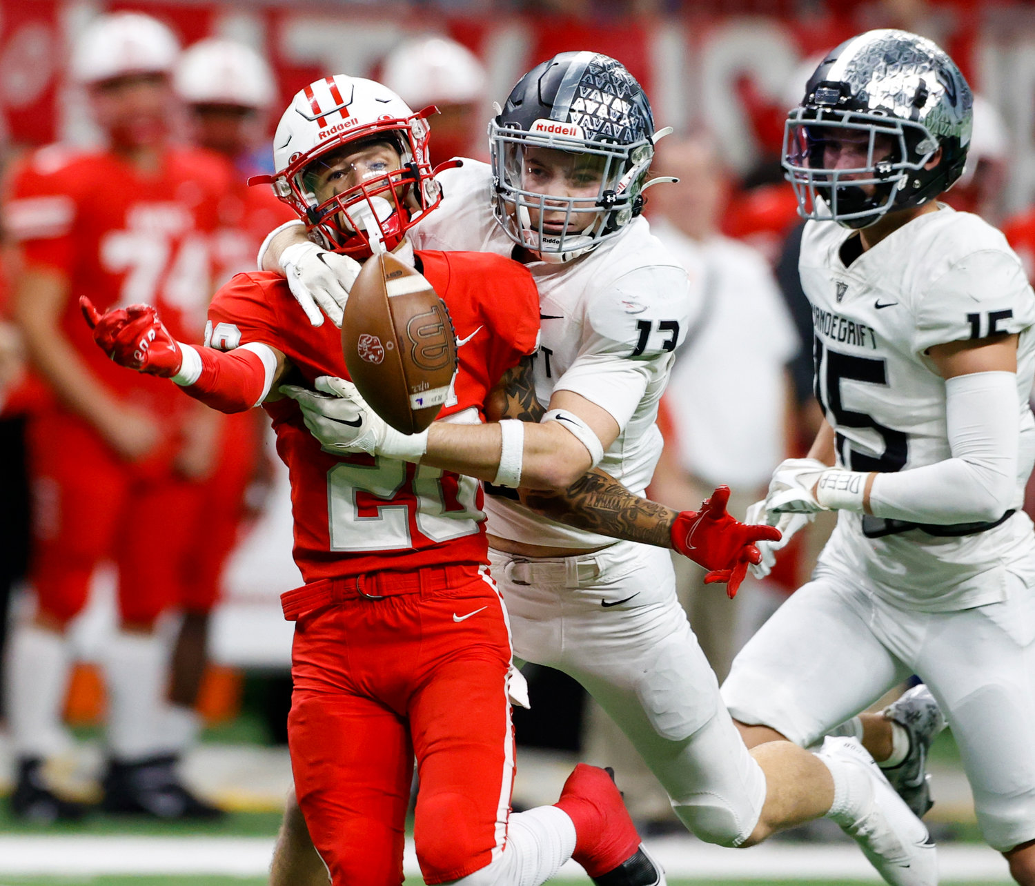 Vandegrift Vipers senior defensive back Davis Scott (13) defends a pass intended for Katy wide receiver Micah Koenig (20) during the Class 6A-DII state semifinal football game between Katy and Vandegrift on Dec. 10, 2022 in San Antonio.