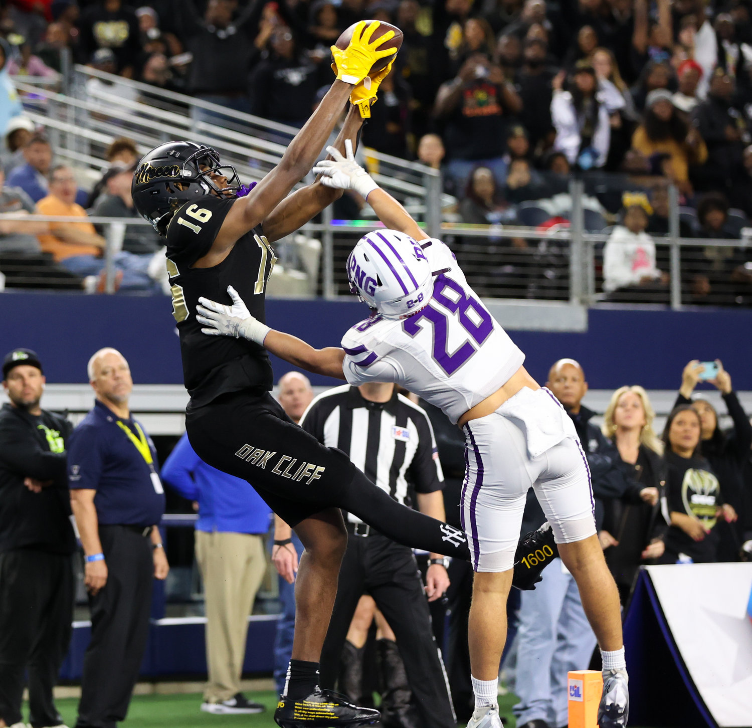 South Oak Cliff wide receiver Trey Jackson (16) makes a touchdown catch over Port Neches-Groves defensive back Reid Richard (28) during the Class 5A Division II football state championship game between South Oak Cliff and Port Neches-Groves in Arlington, Texas, on Dec. 16, 2022.