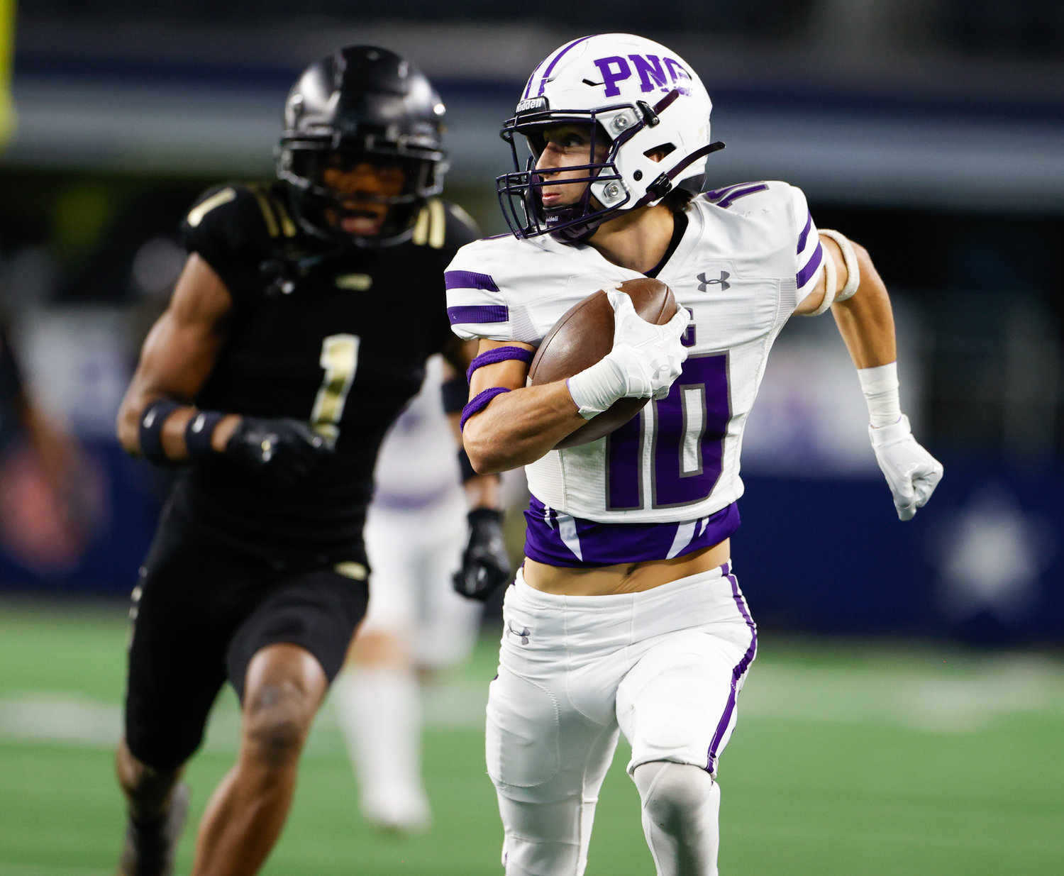 Port Neches-Groves defensive back Landon Guarnere (10) carries the ball for a touchdown after a catch during the Class 5A Division II football state championship game between South Oak Cliff and Port Neches-Groves in Arlington, Texas, on Dec. 16, 2022.