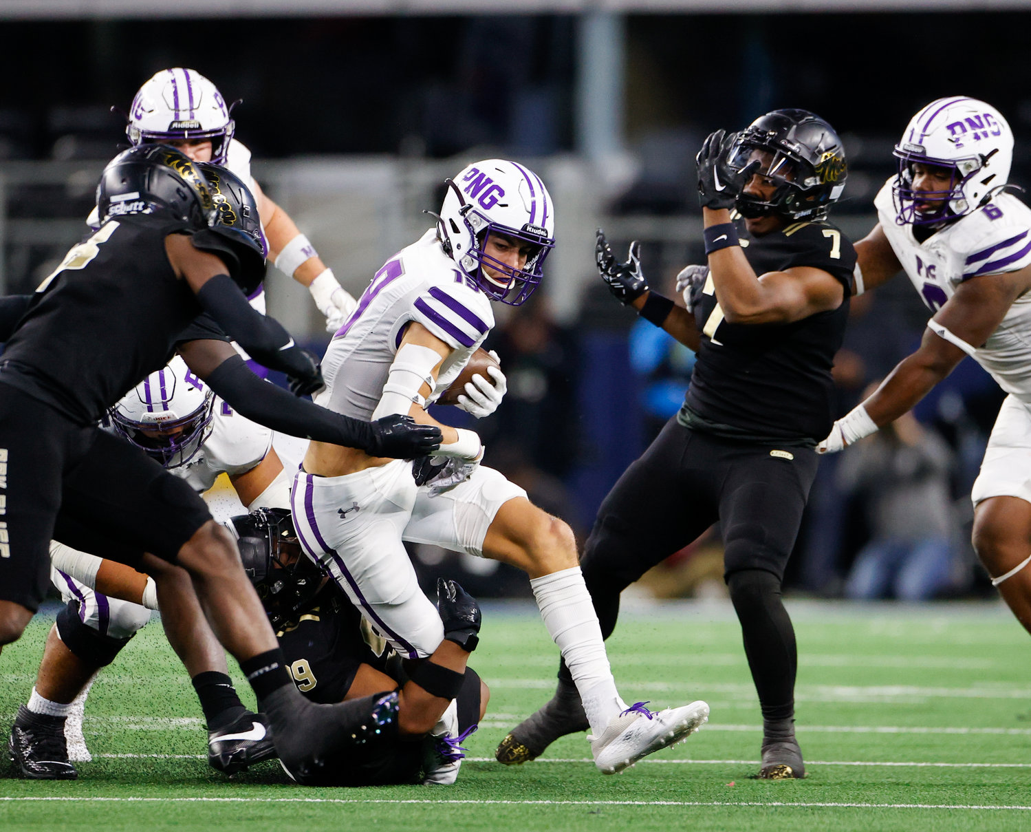 Port Neches-Groves wide receiver Shea Adams (19) carries the ball during the Class 5A Division II football state championship game between South Oak Cliff and Port Neches-Groves in Arlington, Texas, on Dec. 16, 2022.