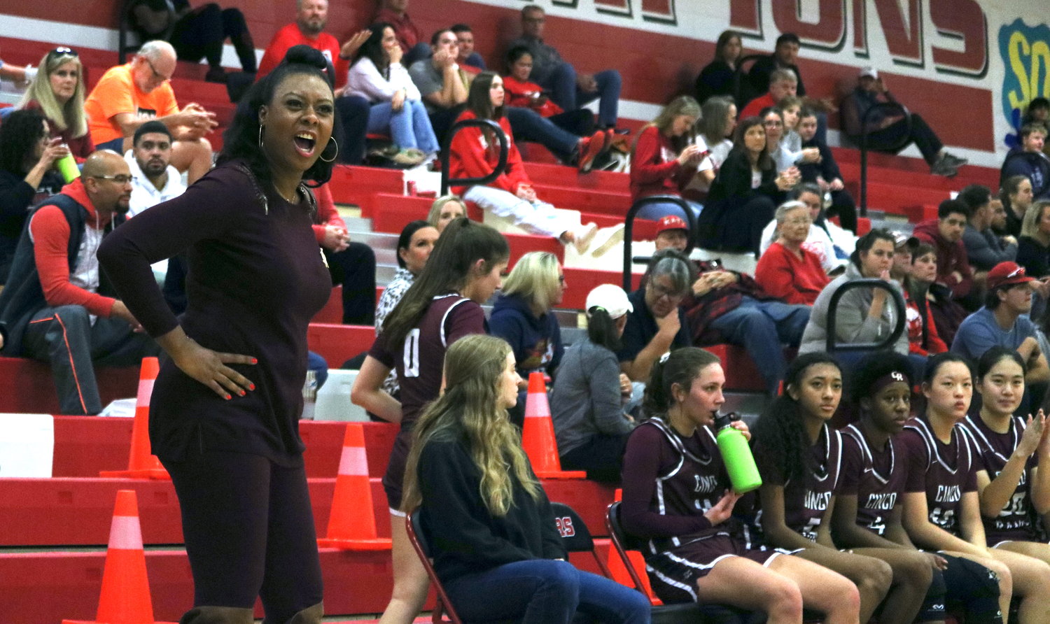 Cinco Ranch head coach Tamara Collier talks to a player during Tuesday’s game between Katy and Cinco Ranch at the Katy gym.