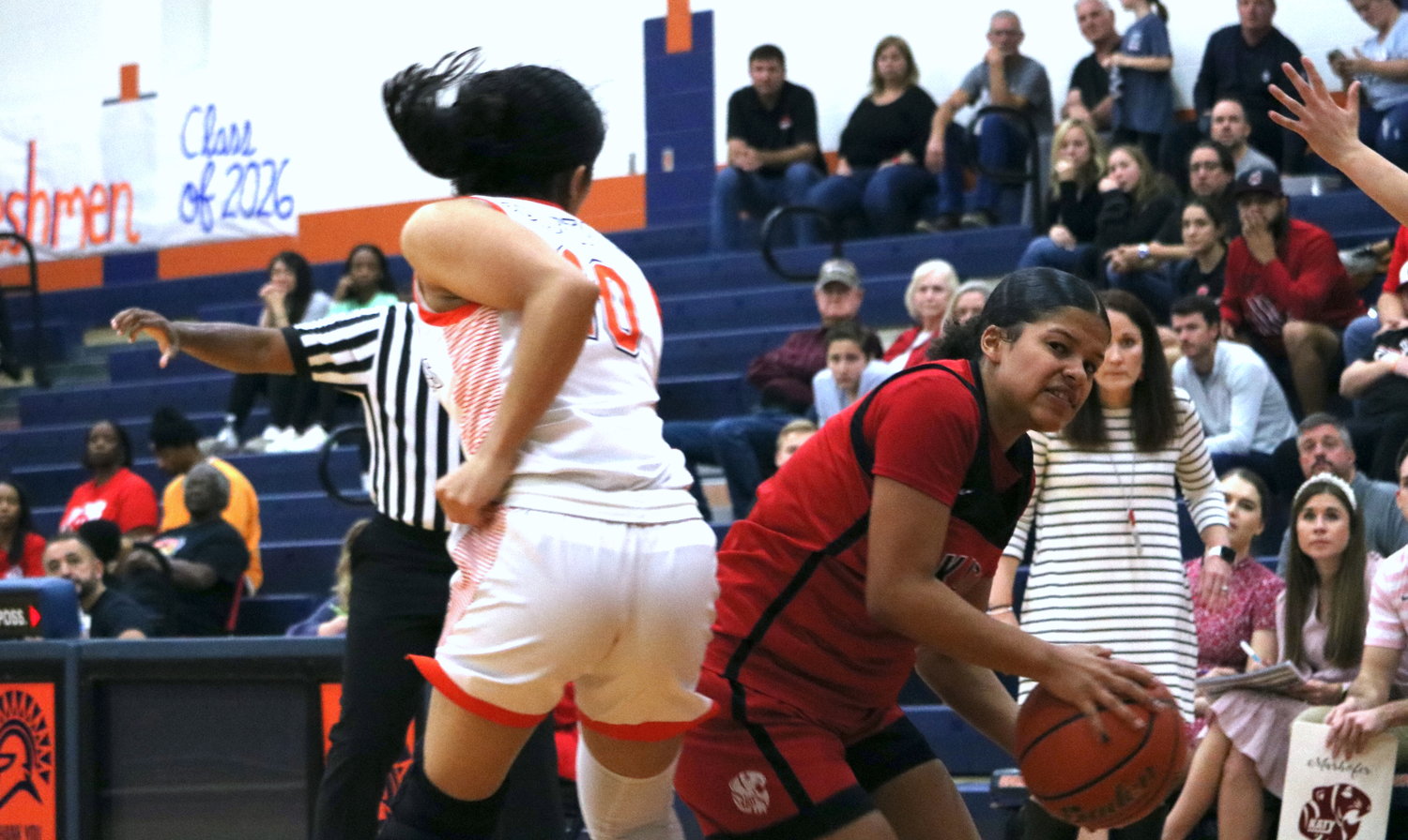 Ashlynn Alexander drives past a defender during Tuesday's game between Katy and Seven Lakes at the Seven Lakes gym.