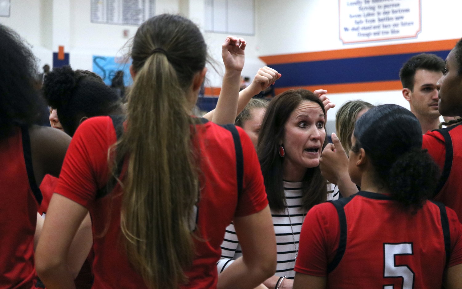 Katy head coach Shanna Marhofer talks to her team in a huddle during Tuesday's game between Katy and Seven Lakes at the Seven Lakes gym.