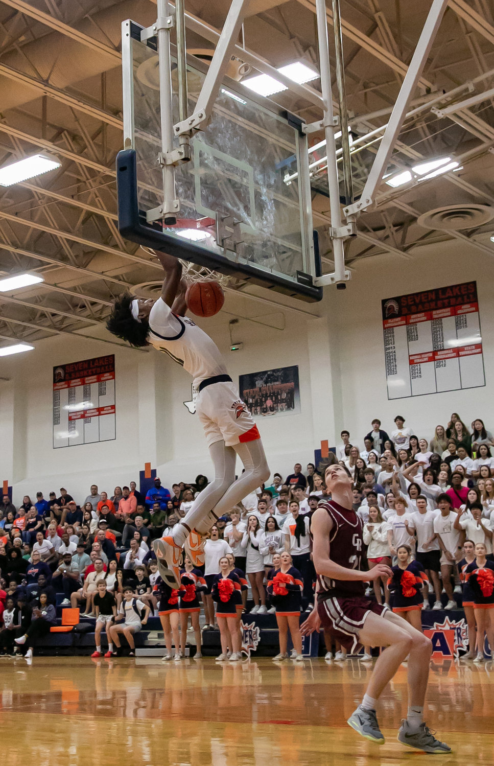 Nasir Price throws down a dunk during Saturday's game between Seven Lakes and Cinco Ranch at the Seven Lakes gym.