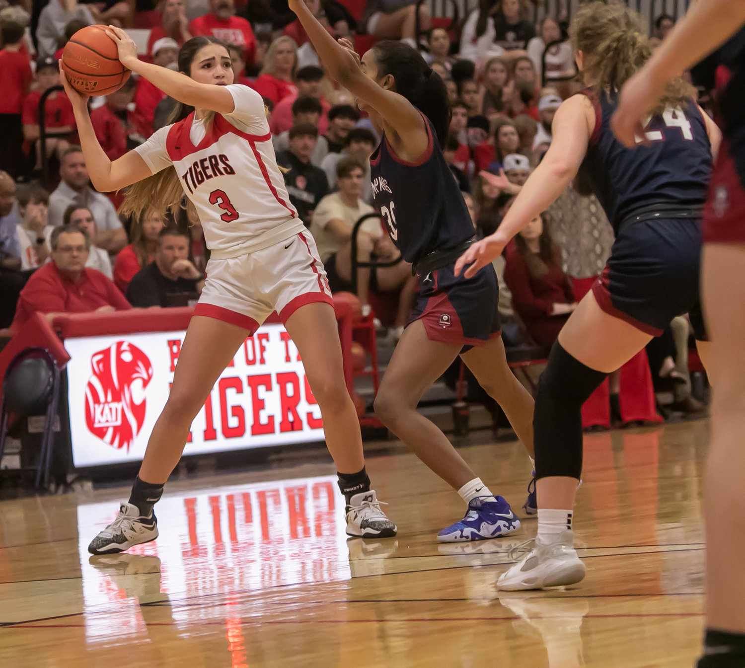 Nyla Wold looks to pass the ball during Tuesday's game between Katy and Tompkins at the Katy gym.