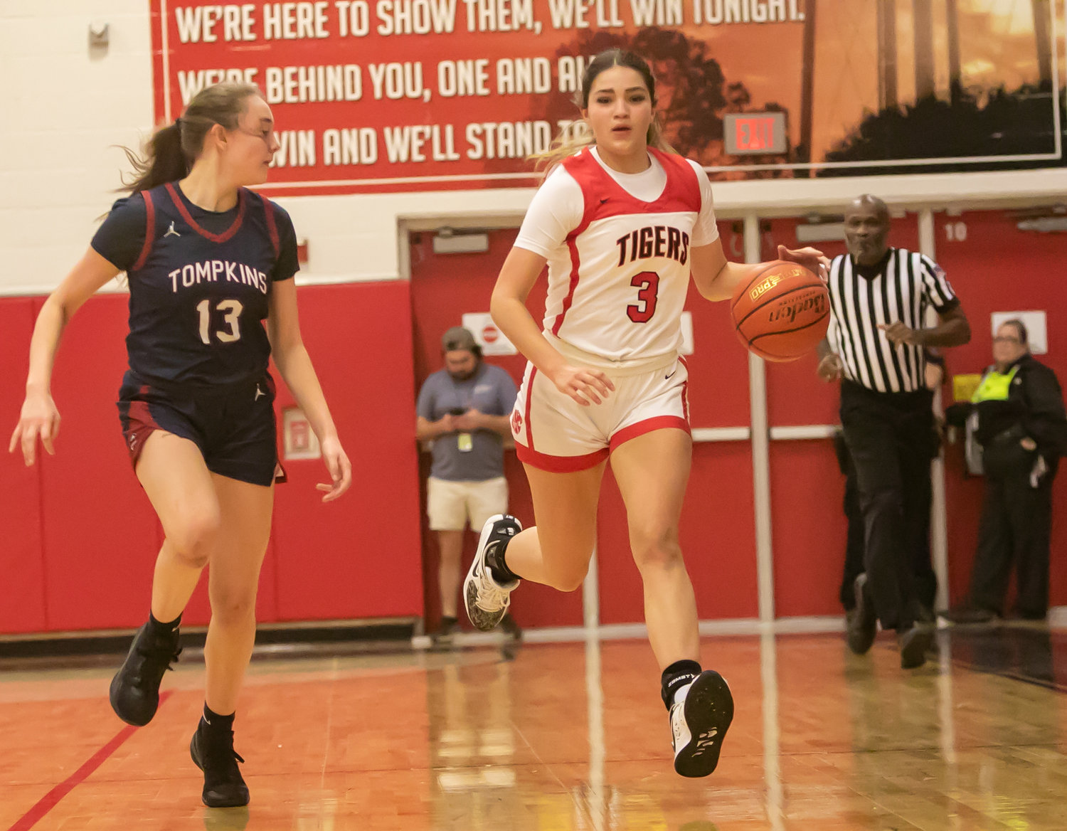 Nyla Wold dribbles the ball up the court during Tuesday's game between Katy and Tompkins at the Katy gym.