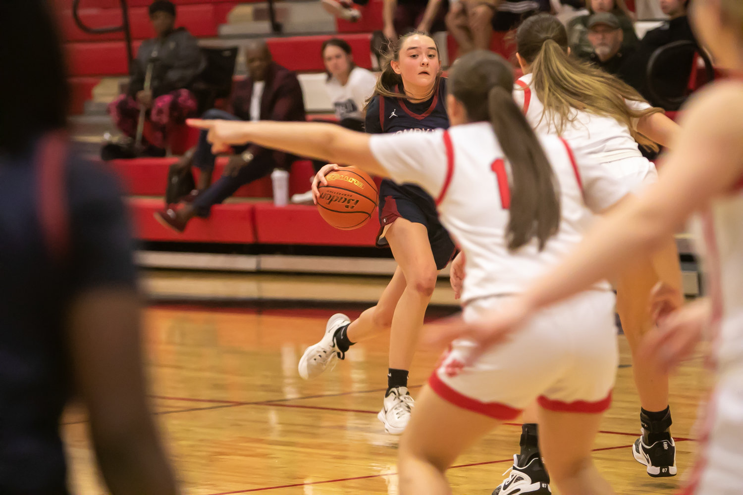 Macy Spencer dribbles into the lane during Tuesday's game between Katy and Tompkins at the Katy gym.