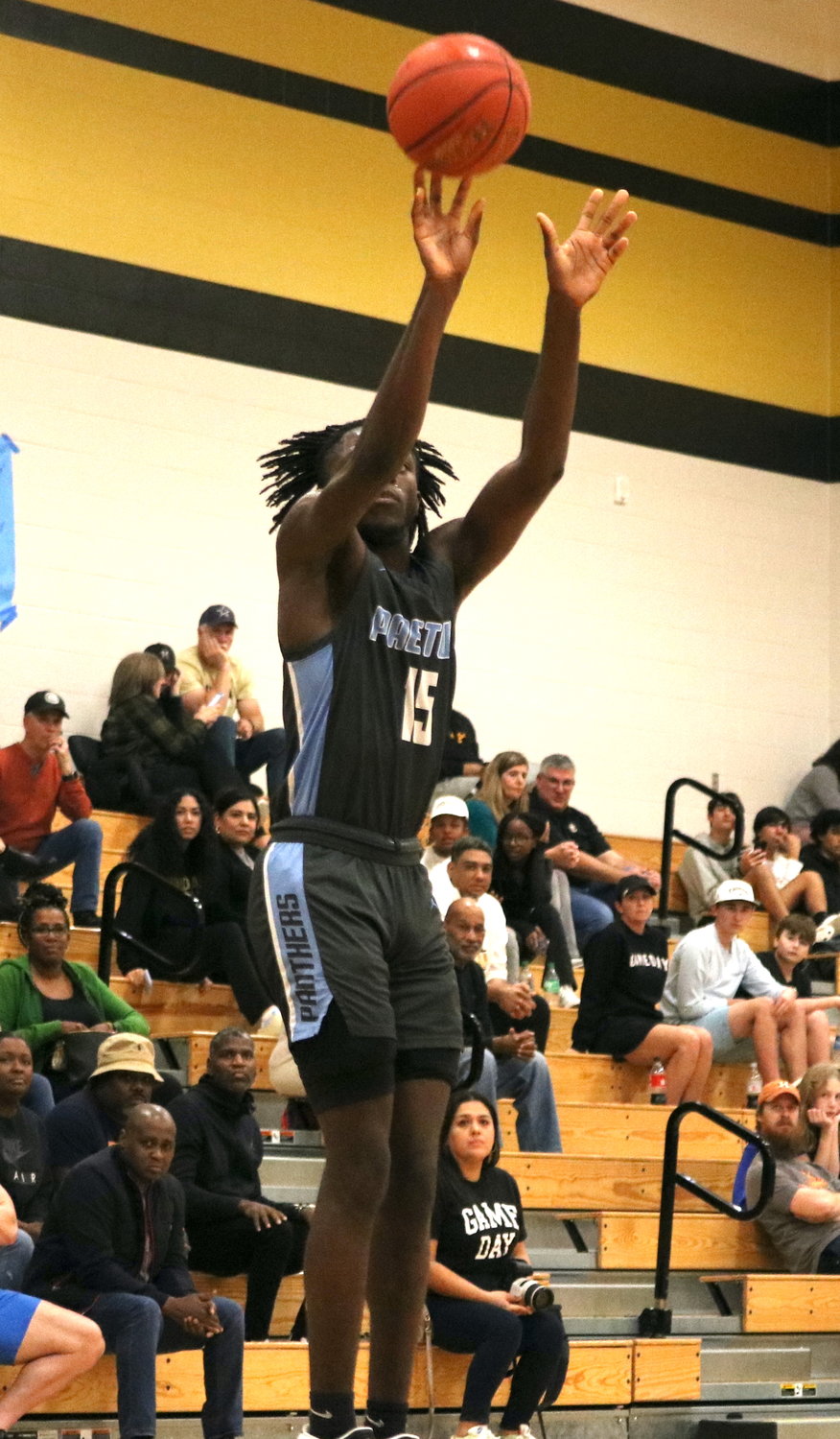 Ade Onaleye shoots a 3-pointer during Wednesday's game between Paetow and Jordan at the Jordan gym.