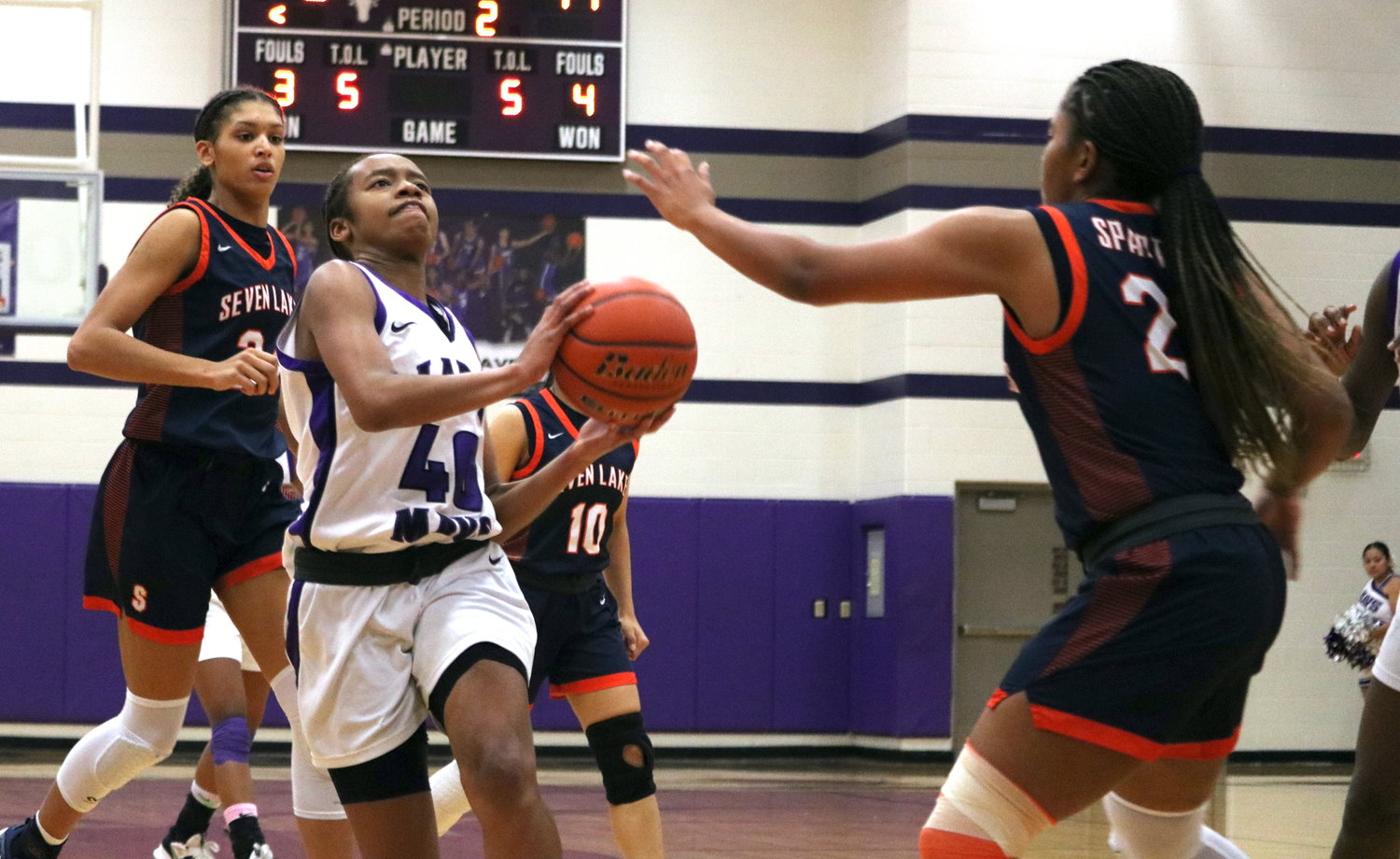 Trinitee McFarland drives to the basket during Friday's game between Seven Lakes and Morton Ranch at the Morton Ranch gym.