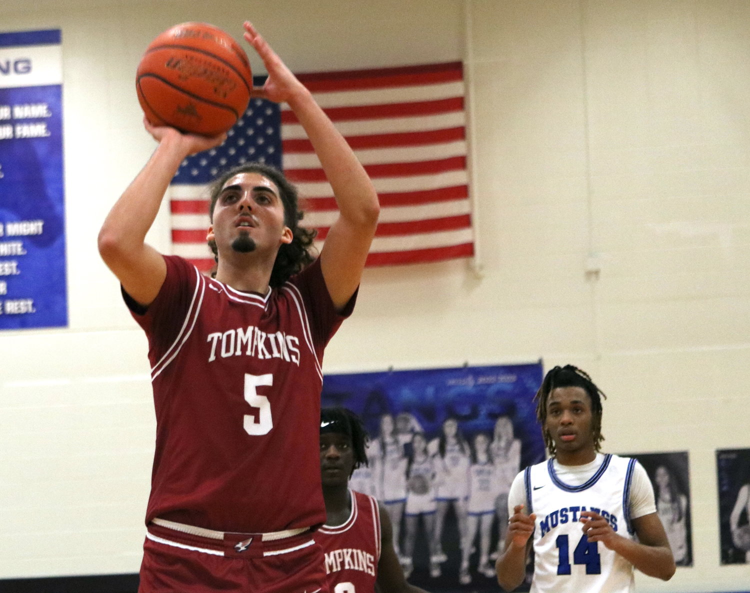 Luke Coughran shoots a free throw during Saturday's game between Tompkins and Taylor at the Taylor gym.