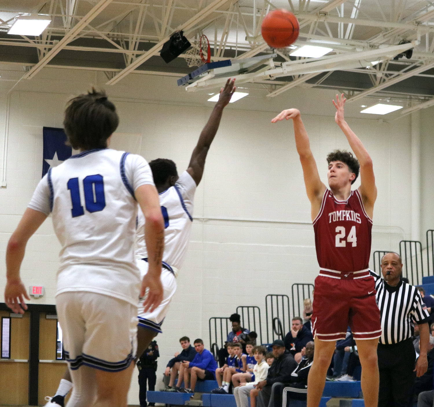 Grant Schulenberg shoots a jumper during Saturday's game between Tompkins and Taylor at the Taylor gym.