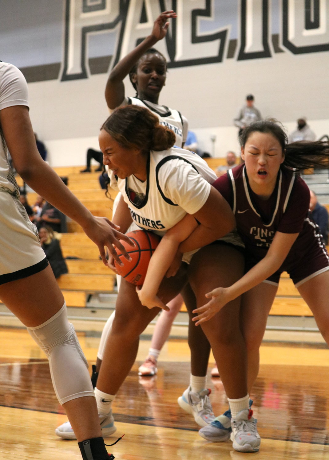 Jaleesa Kua pulls down a rebound during Friday's game between Cinco Ranch and Paetow at the Paetow gym.