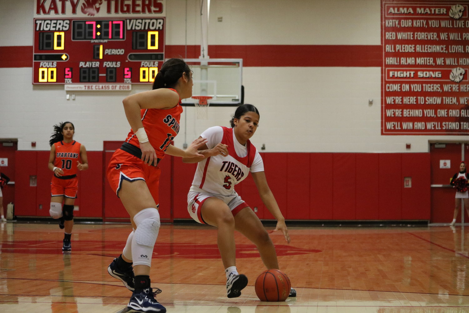 Ashlynn Alexander tries to spin past a defender during Friday's game between Seven Lakes and Katy at the Katy gym.