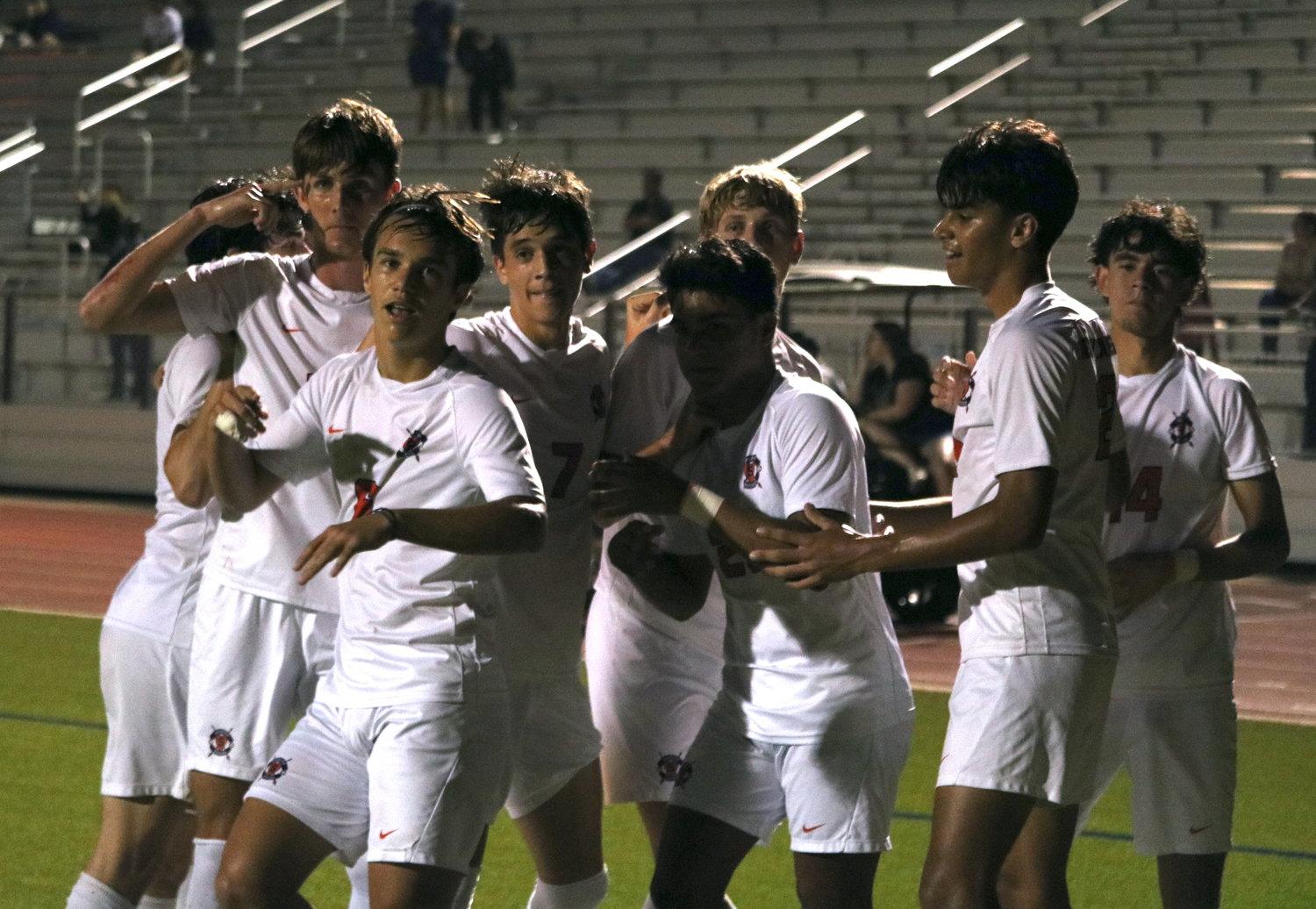 Seven Lakes players celebrate after scoring a goal during Tuesday's District 19-6A game between Seven Lakes and Paetow at the Paetow soccer field.