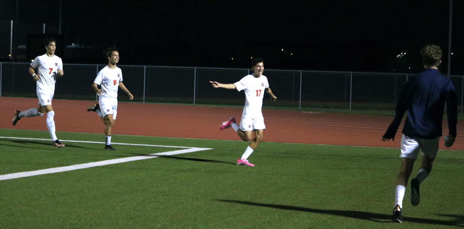 Sean Carlos Rivera celabrates after scoring a goal during Tuesday's District 19-6A game between Seven Lakes and Paetow at the Paetow soccer field.