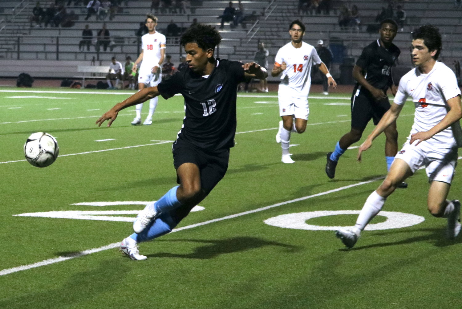 Alex Alexander brings a ball down during Tuesday's District 19-6A game between Seven Lakes and Paetow at the Paetow soccer field.