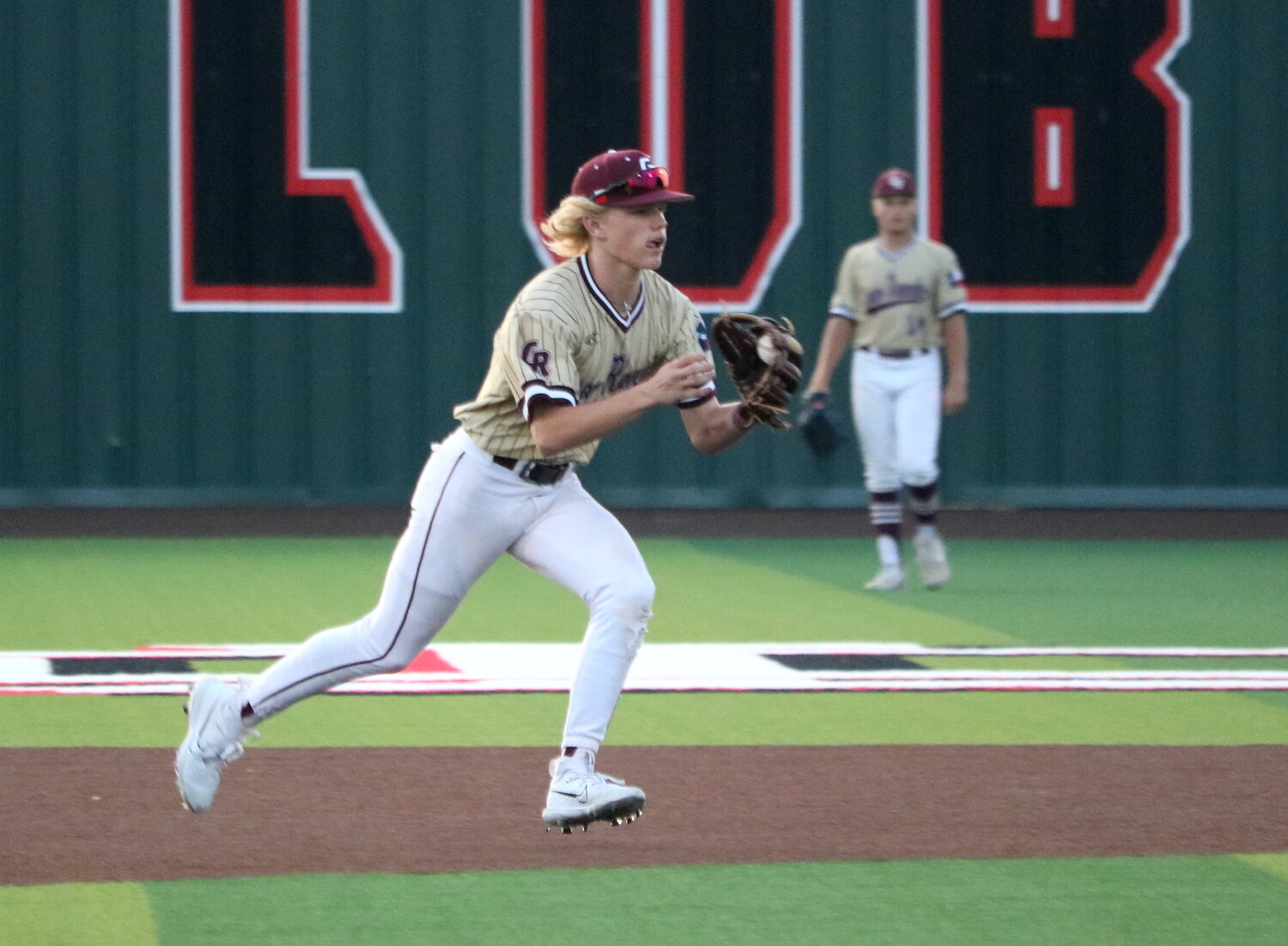 Brock DeYoung throws to first base during Friday's Regional Quarterfinal between Cinco Ranch and Ridge Point at Langham Creek.