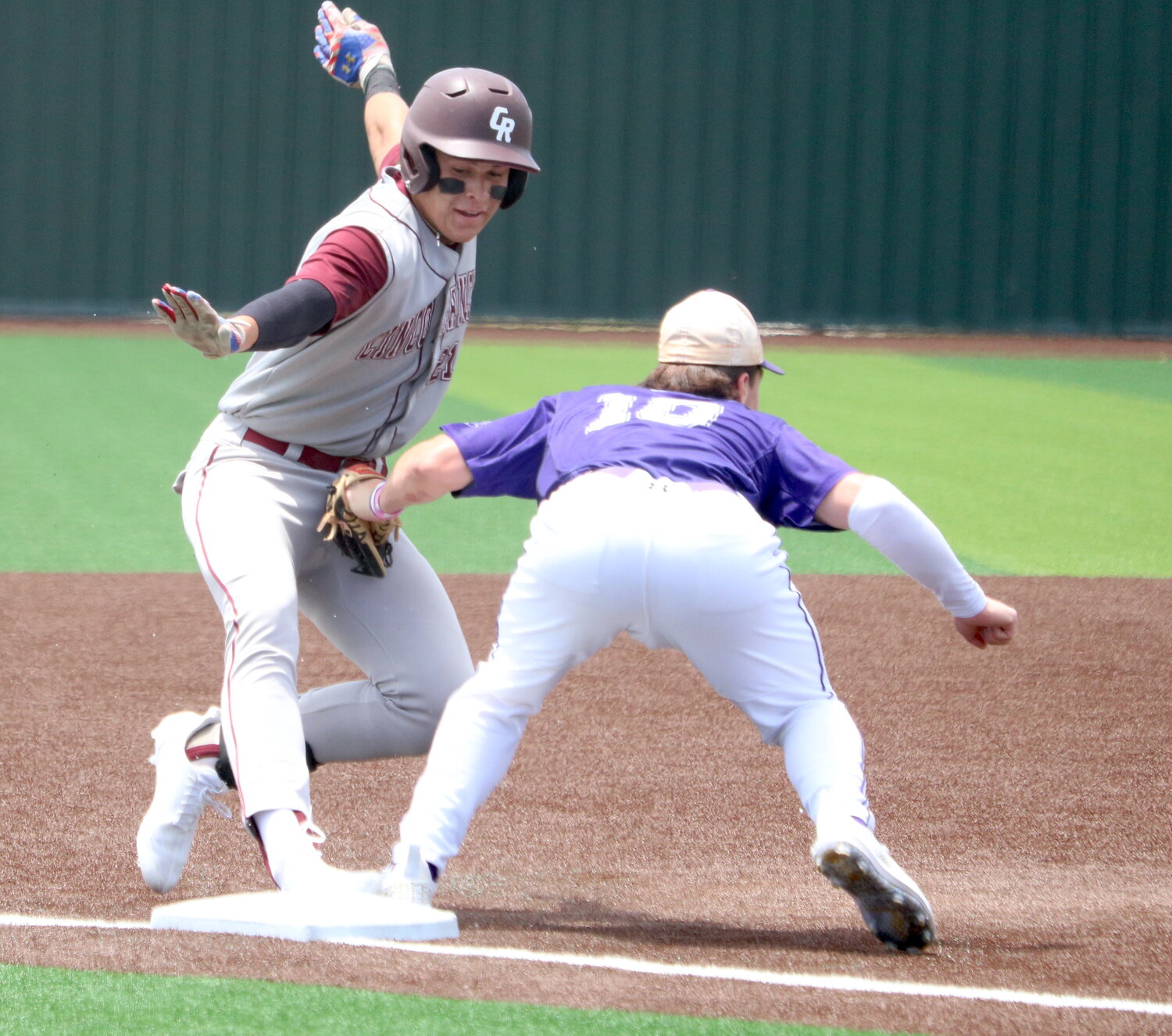 Charlie Atkinson slides into third base during Saturday's Regional Quarterfinal between Cinco Ranch and Ridge Point.