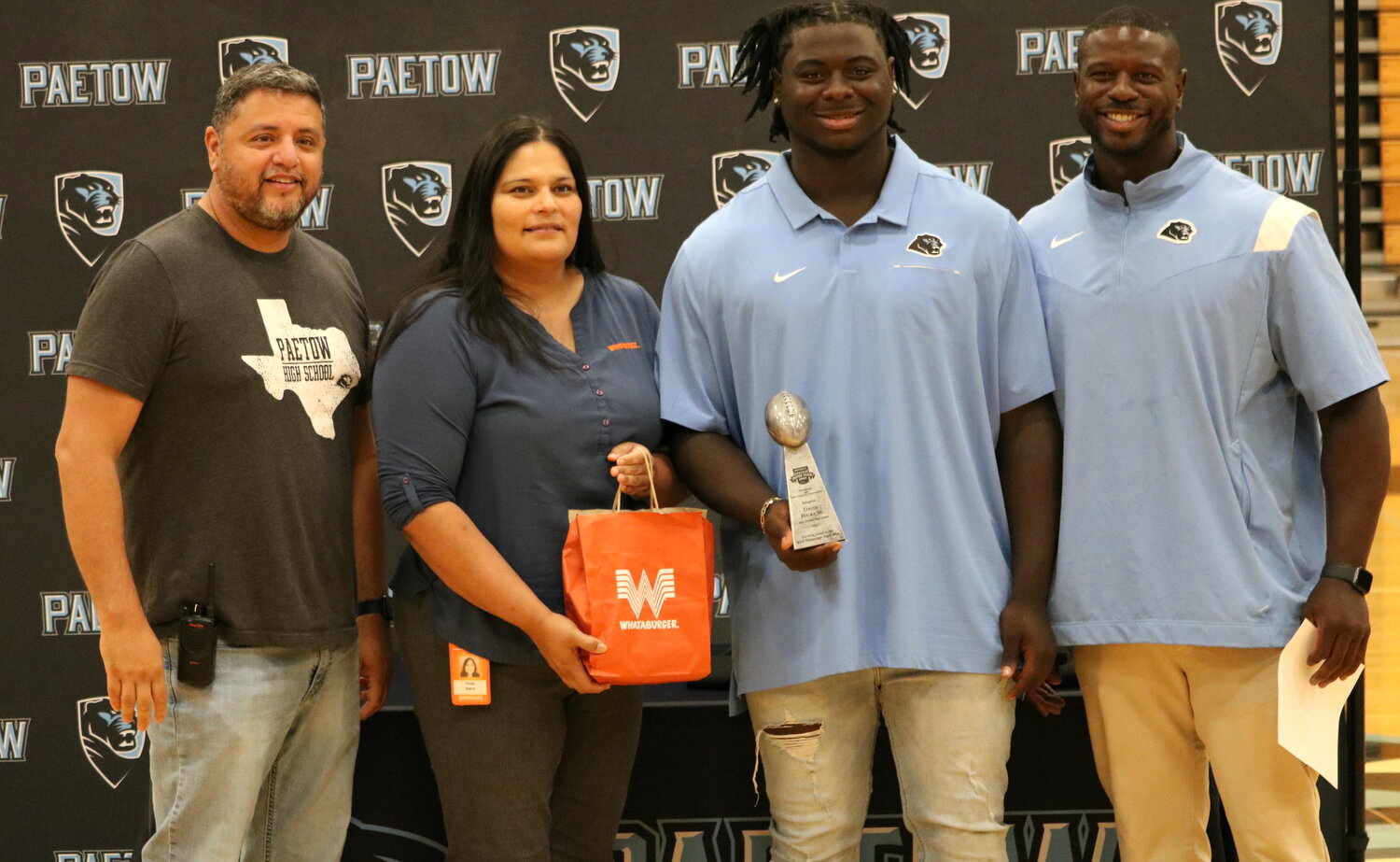 D.J. Hicks with his Whataburger Team of the Year trophy.