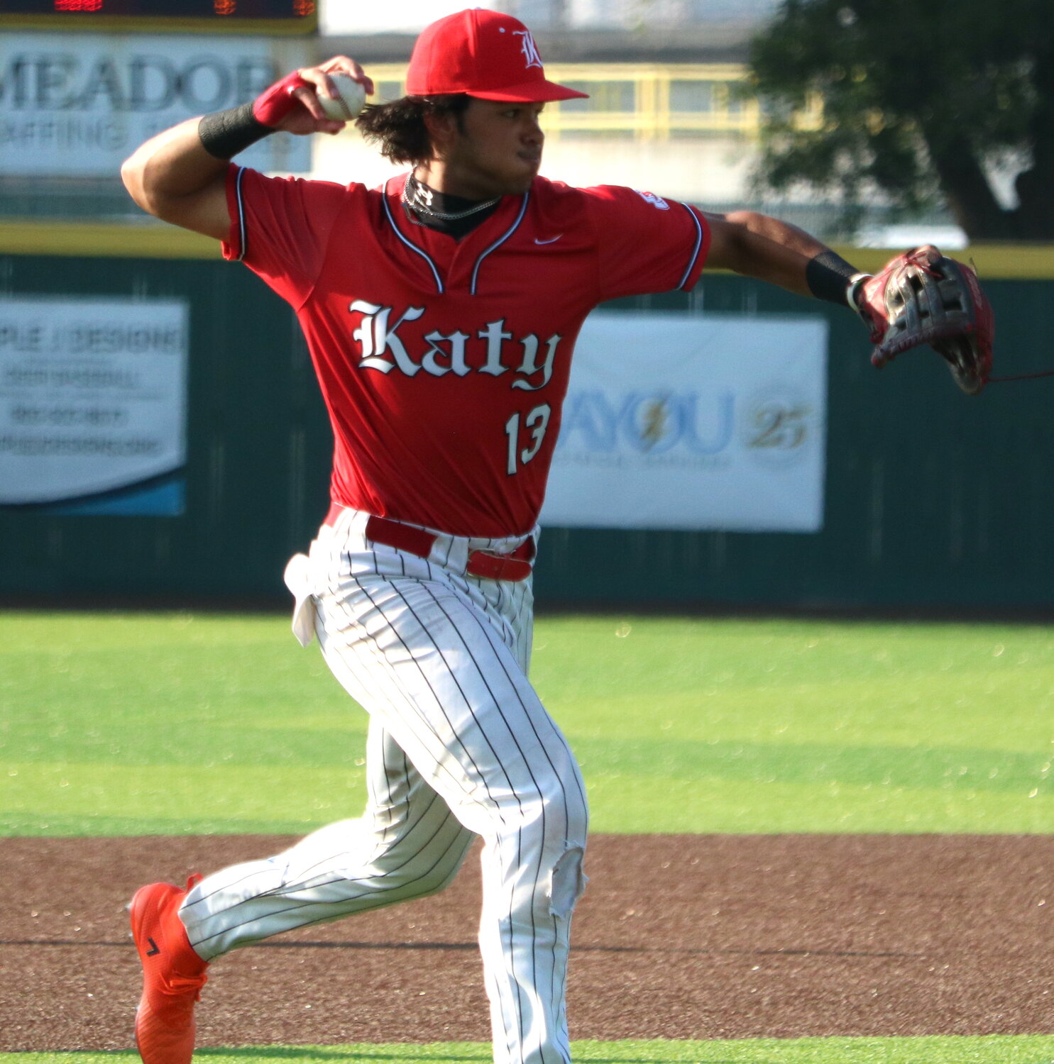 Nayden Ramirez throws to first during Wednesday's Regional Semifinal between Katy and Clear Springs at Deer Park.