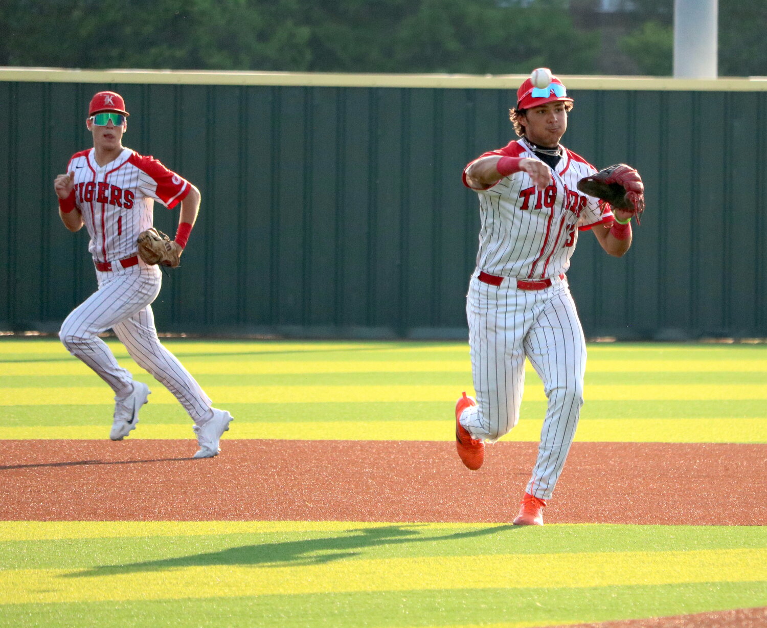 Nayden Ramirez throws to first during Thursday's Regional Semifinal between Katy and Clear Springs at Langham Creek.