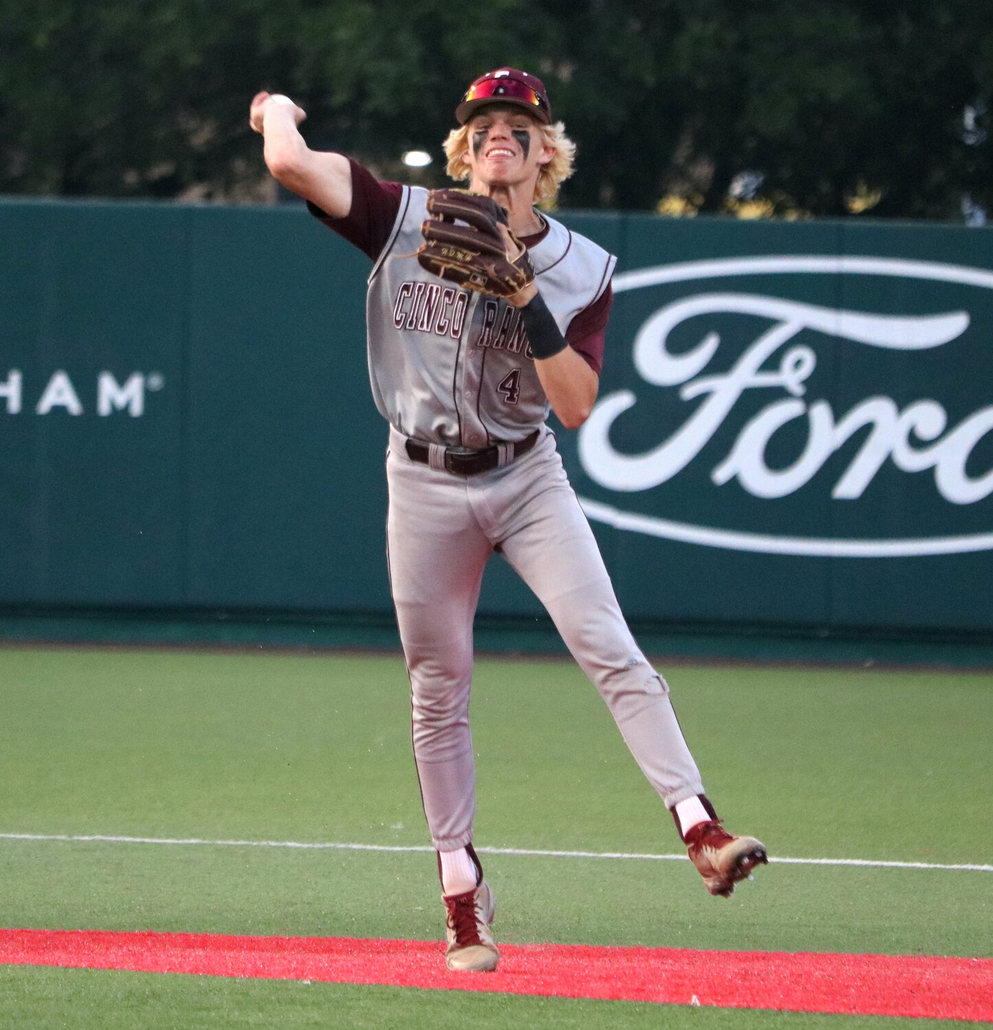 Brock DeYoung throws to first during Friday's regional semifinal between Cinco Ranch and Pearland at The University of Houston.