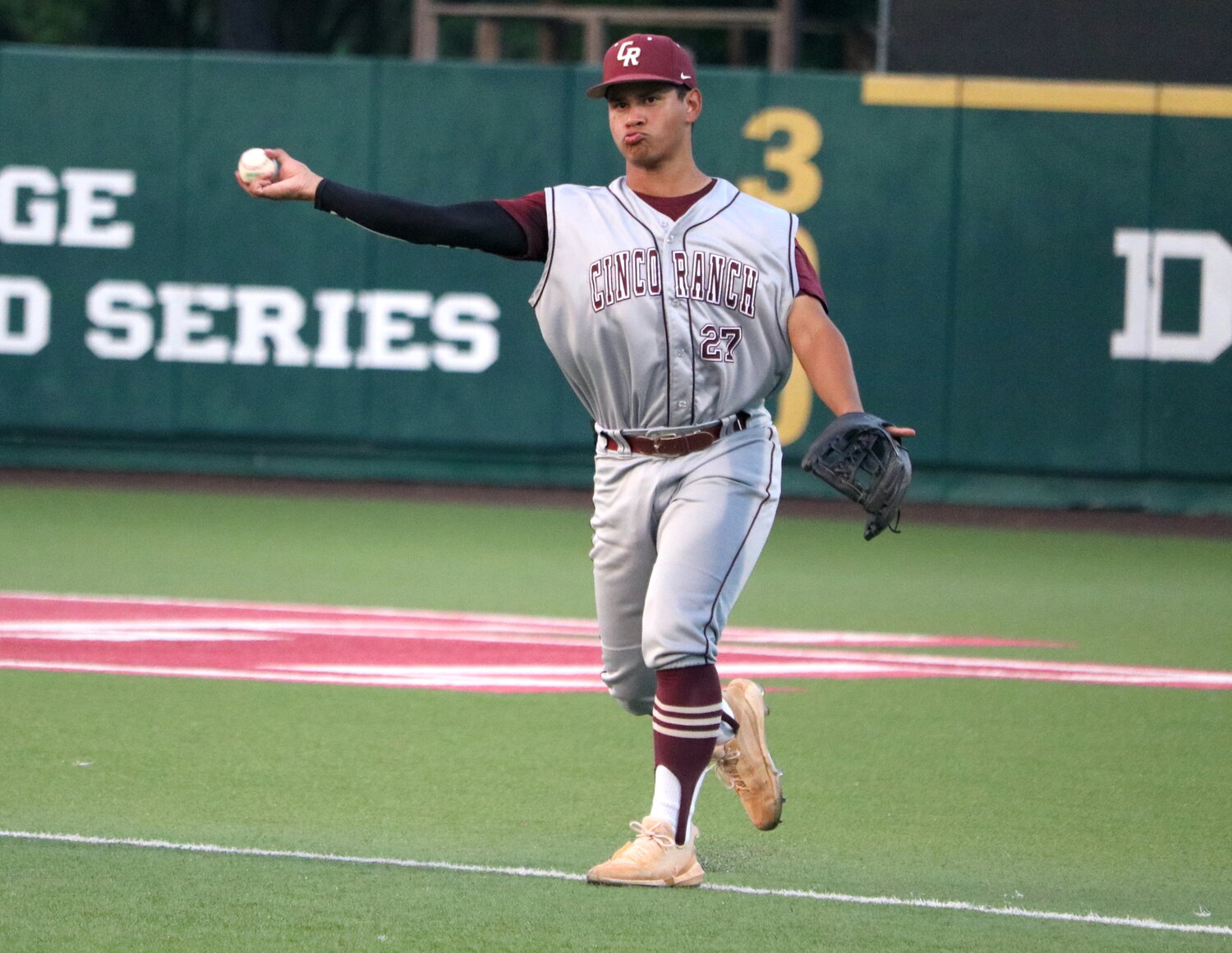 Rainier Castillo throws to first during Friday's regional semifinal between Cinco Ranch and Pearland at The University of Houston.