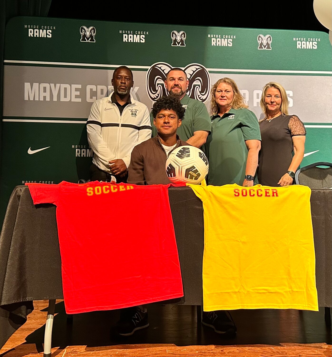 Mayde Creek's Italo Rodriguez poses for a photo after singing their National Letters of Intent.