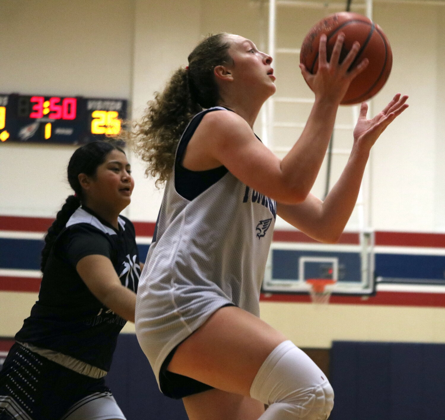 Gabby Panter drives to the basket during Thursday's game between Tompkins and Laredo United South defenders at the Tompkins gym.