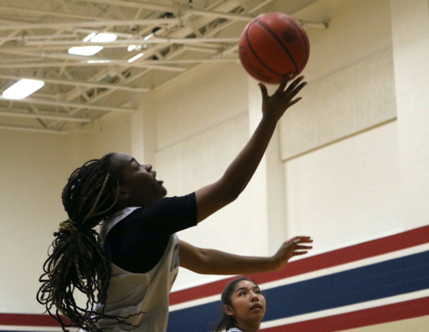 Makayla Tezano shoots a layup during Thursday's game between Tompkins and Laredo United South defenders at the Tompkins gym.