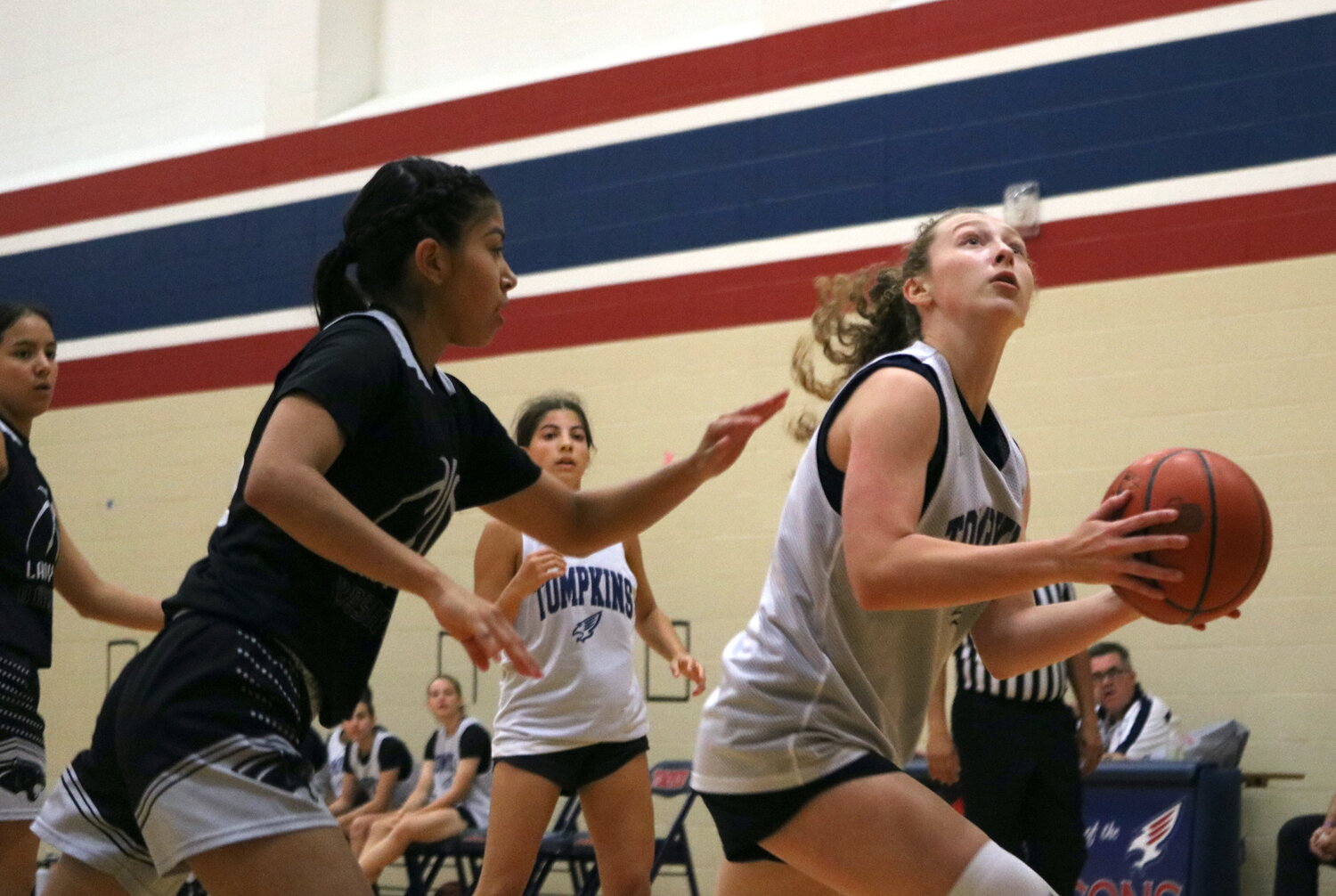 Gabby Painter makes a move in the paint during Thursday's game between Tompkins and Laredo United South defenders at the Tompkins gym.