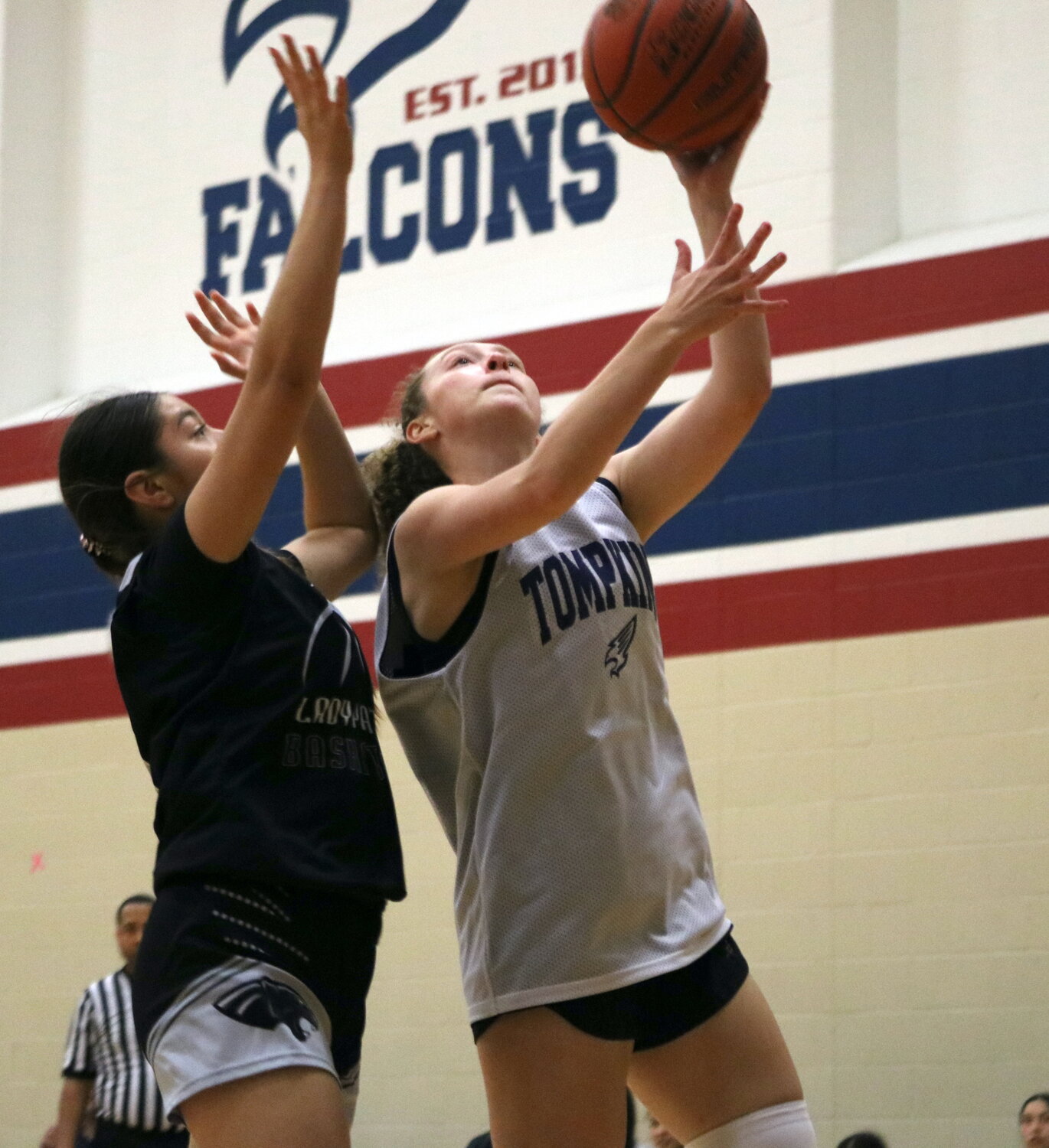 Gabby Painter drives to the basket during Thursday's game between Tompkins and Laredo United South defenders at the Tompkins gym.
