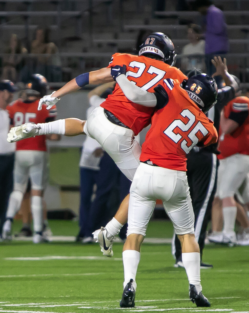 John Paul Anderson and Austin Easterling celebrate during Thursday's game between Seven Lakes and Memorial at Legacy Stadium.