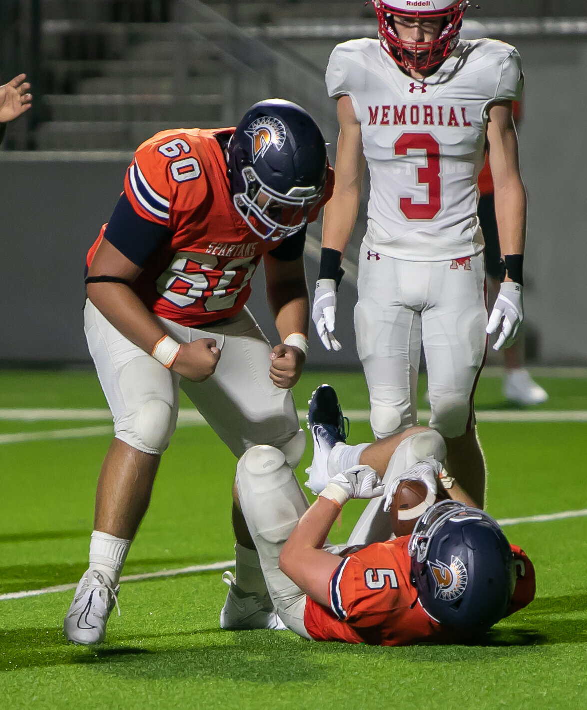 Barrett Hudson and Jason Manrique celebrate after Hudson scored a touchdown during Thursday's game between Seven Lakes and Memorial at Legacy Stadium.