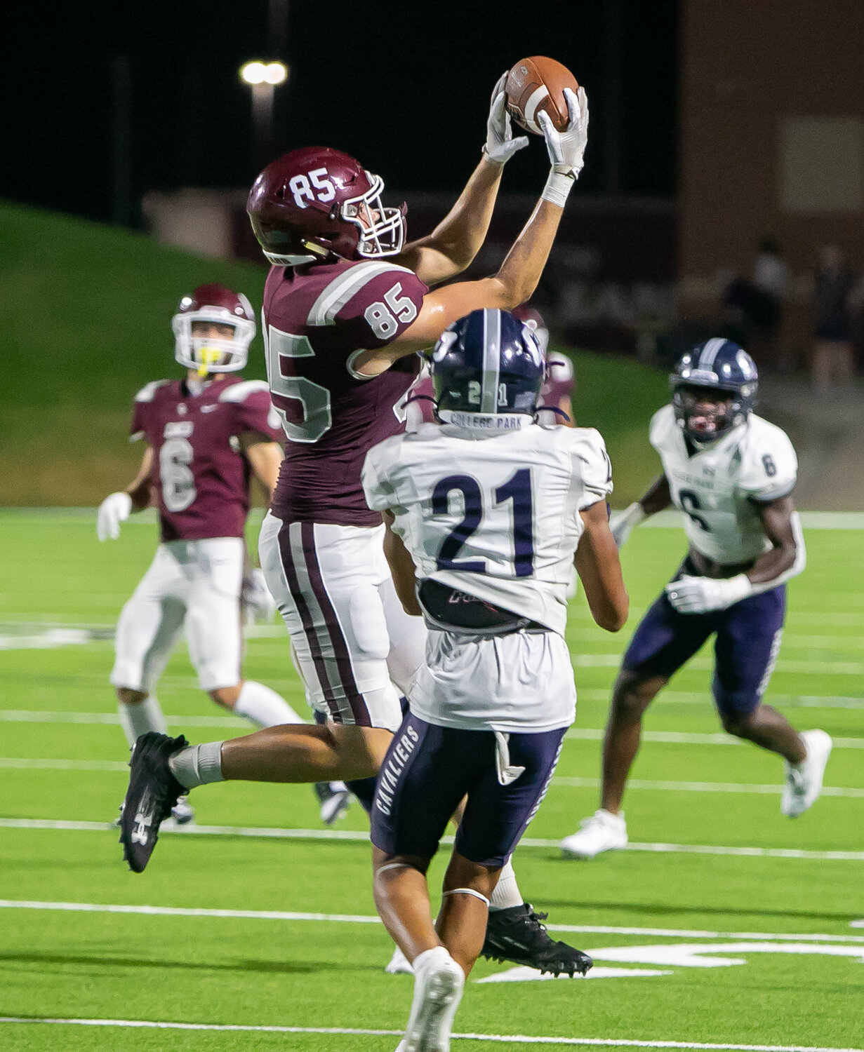 Kellen LeCronier catches a pass during Friday's game between Cinco Ranch and College Park at Rhodes Stadium.