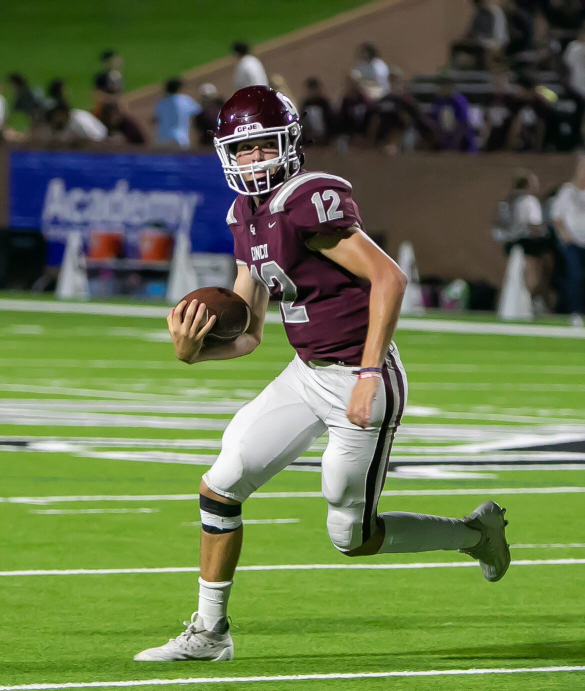 Charlie Adamoli runs the ball during Friday's game between Cinco Ranch and College Park at Rhodes Stadium.