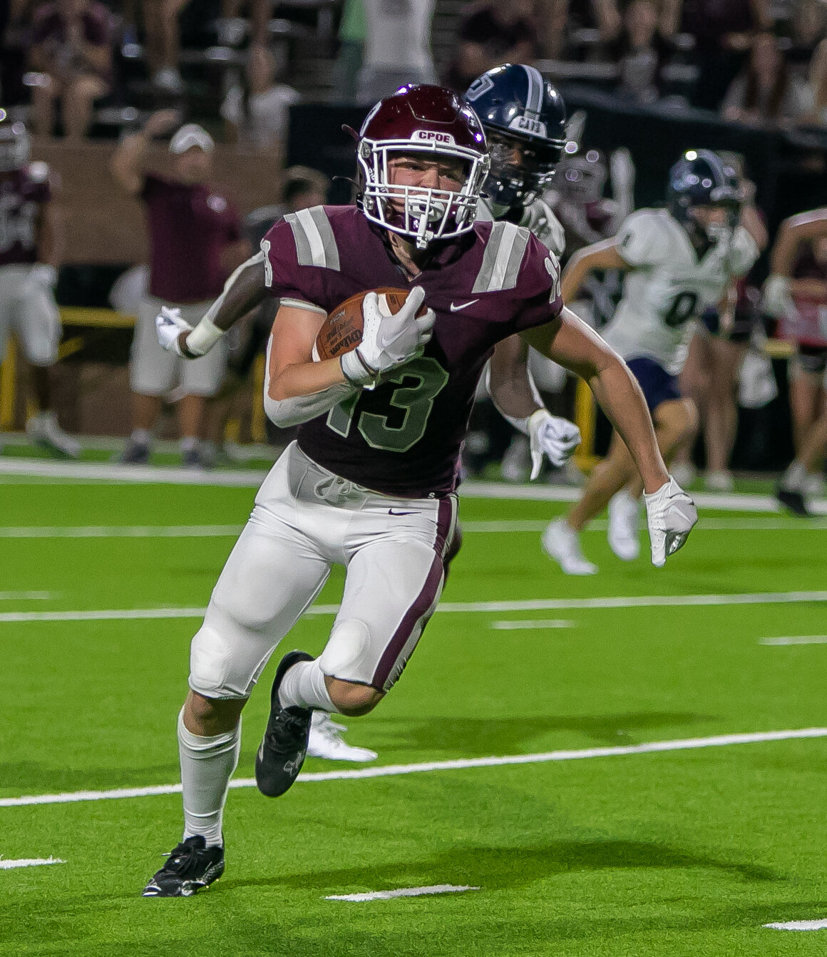 Drew Tureau takes off downfield after a catch during Friday's game between Cinco Ranch and College Park at Rhodes Stadium.