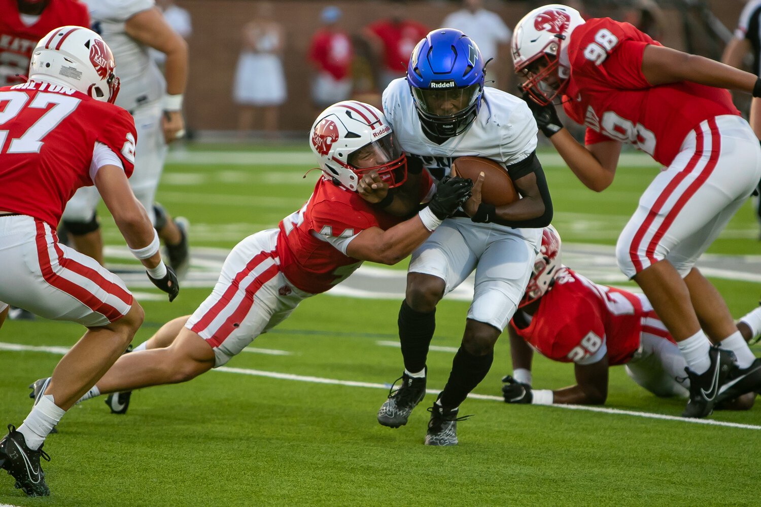 Connor Johnsey takes down a clear Springs player during Saturday's game between Katy and Clear Springs at Rhodes Stadium.