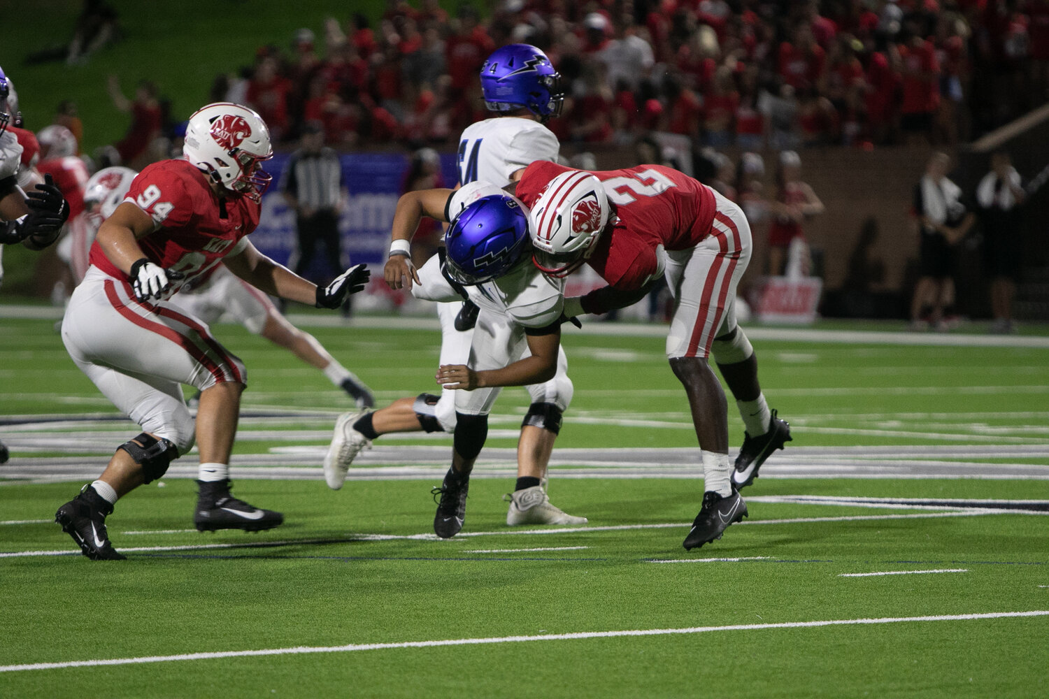 Dak Brinkley and Tyler Willis tackle a Clear Springs player during Saturday's game between Katy and Clear Springs at Rhodes Stadium.