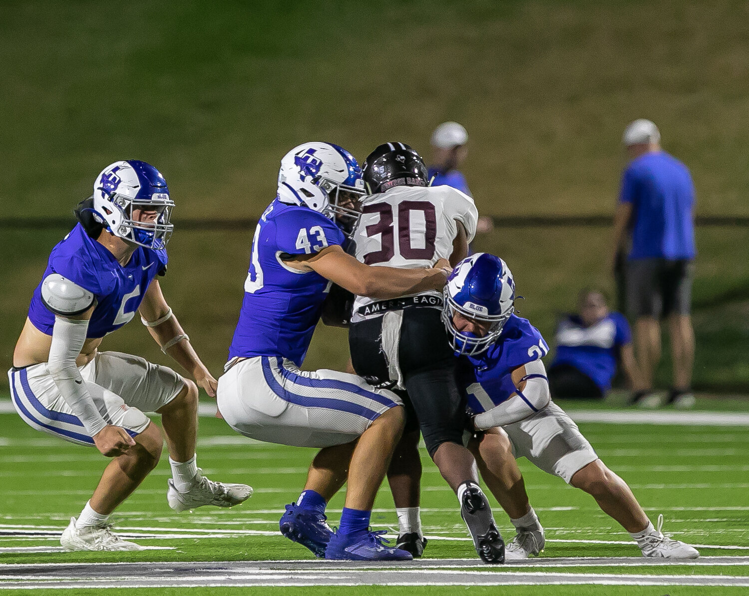 Patrick Miller and Connor Chupa make a tackle on George Ranch's Malachi Montgomery during Thursday's game between Taylor and George Ranch at Rhodes Stadium.