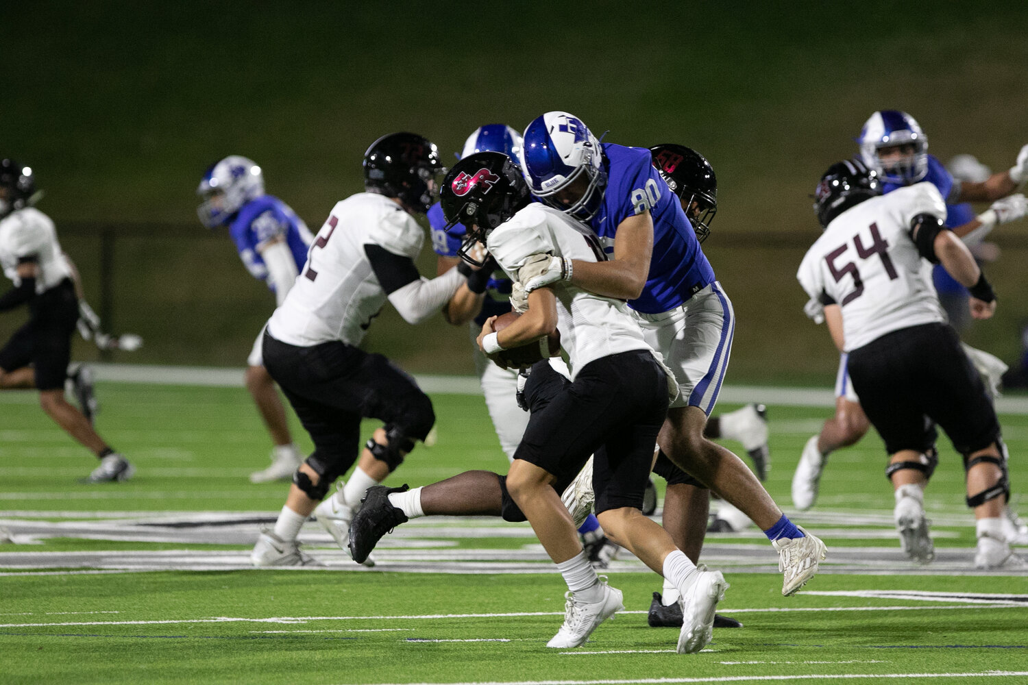 Ashton Coker sacks a Goerge Ranch quarterback during Thursday's game between Taylor and George Ranch at Rhodes Stadium.