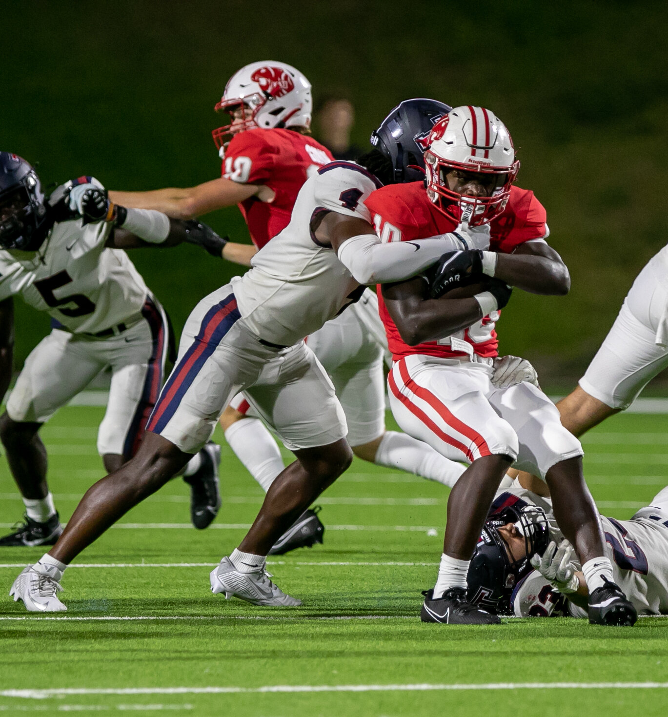 Tremayne Hill fights for yardage during Friday's game between Katy and Tompkins at Rhodes Stadium.