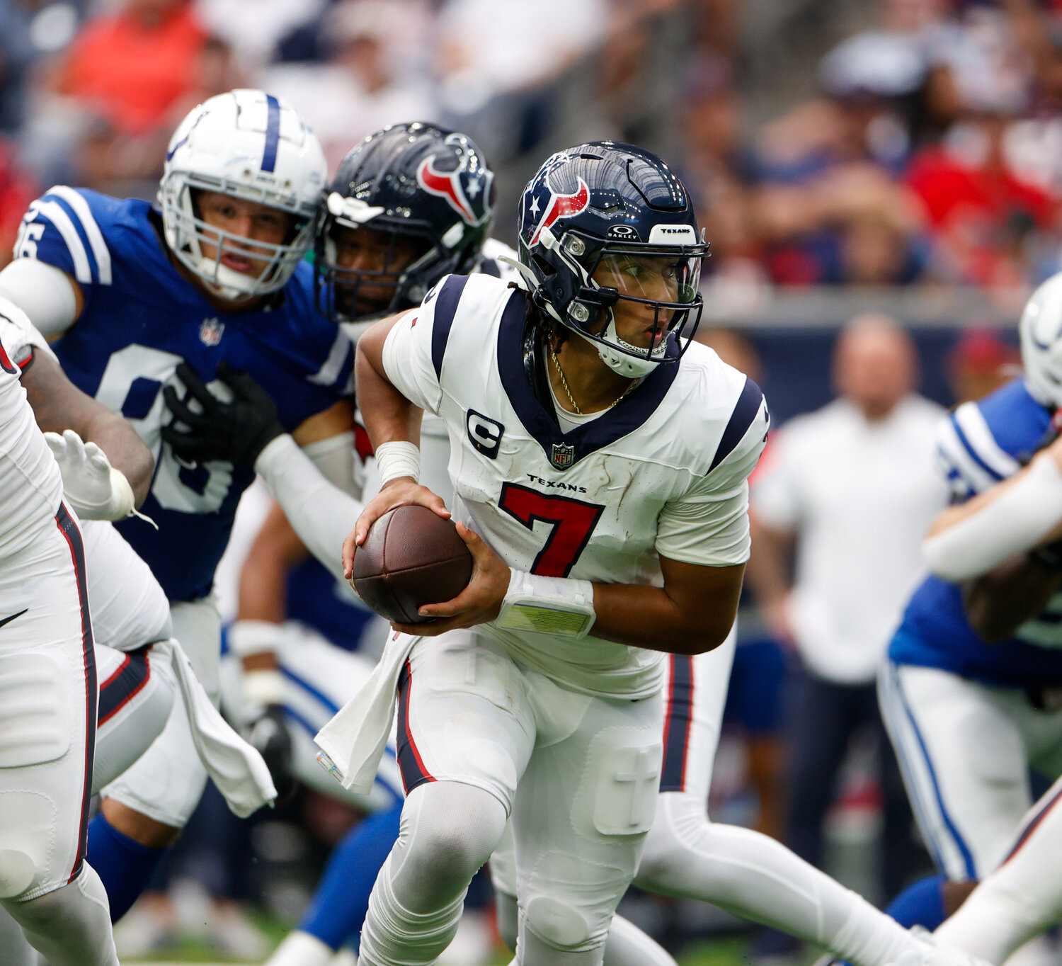 Texans quarterback C.J. Stroud (7) rolls out after a snap during an NFL game between the Texans and the Colts on September 17, 2023 in Houston. The Colts won, 31-20.