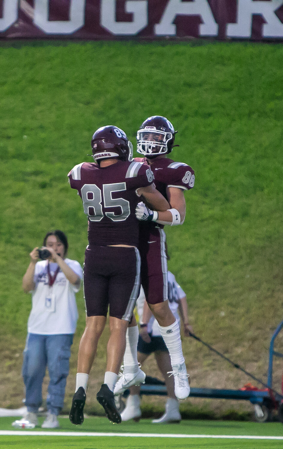 Kellen LeCronier and Nathan Olivier celebrate after Olivier scored a touchdown during Friday's District 19-6A game between Cinco Ranch and Morton Ranch on Friday at Rhodes Stadium.