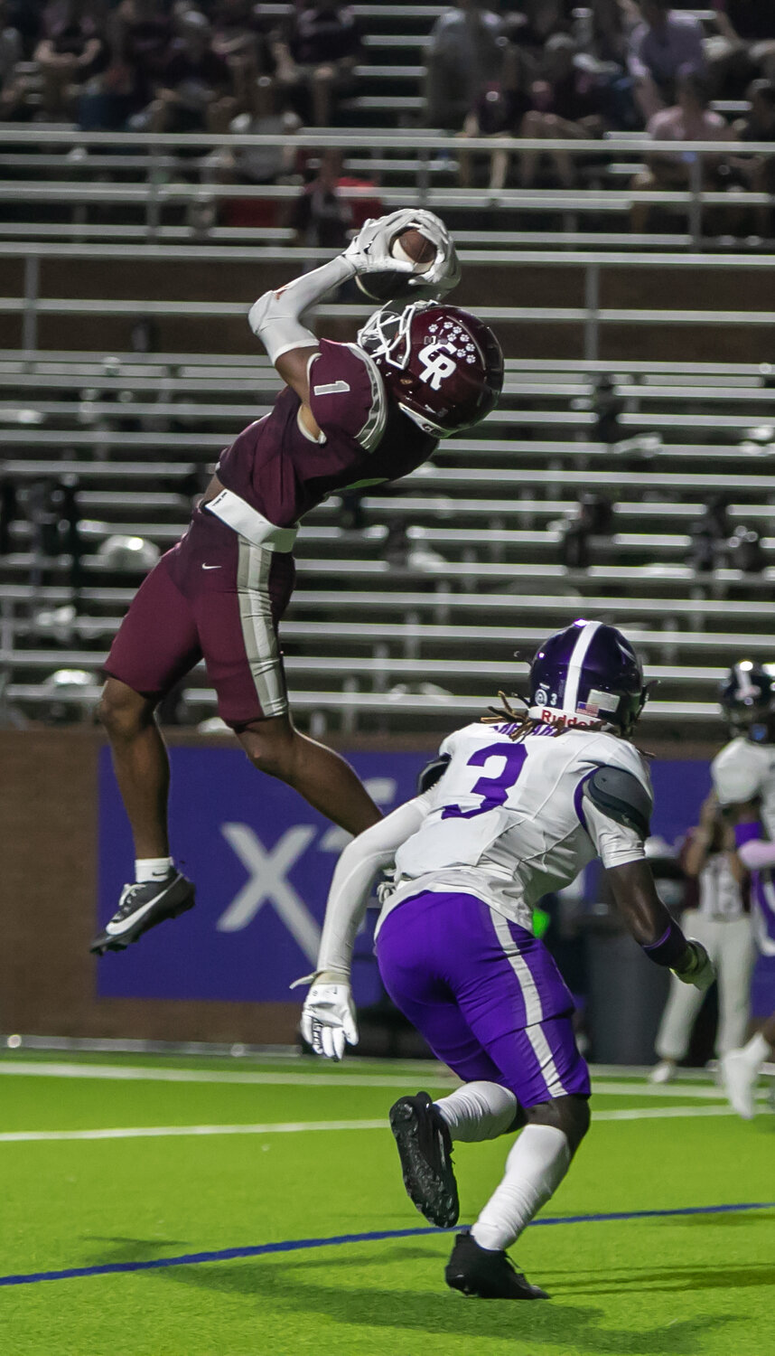 Taytum Johnson makes a catch for a touchdown during Friday's District 19-6A game between Cinco Ranch and Morton Ranch on Friday at Rhodes Stadium.
