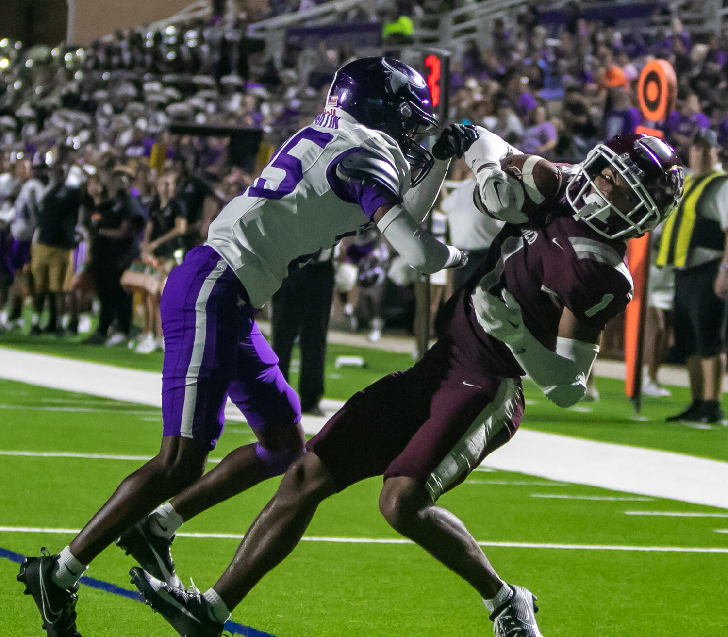 Taytum Johnson comes down with a touchdown catch during Friday's District 19-6A game between Cinco Ranch and Morton Ranch on Friday at Rhodes Stadium.